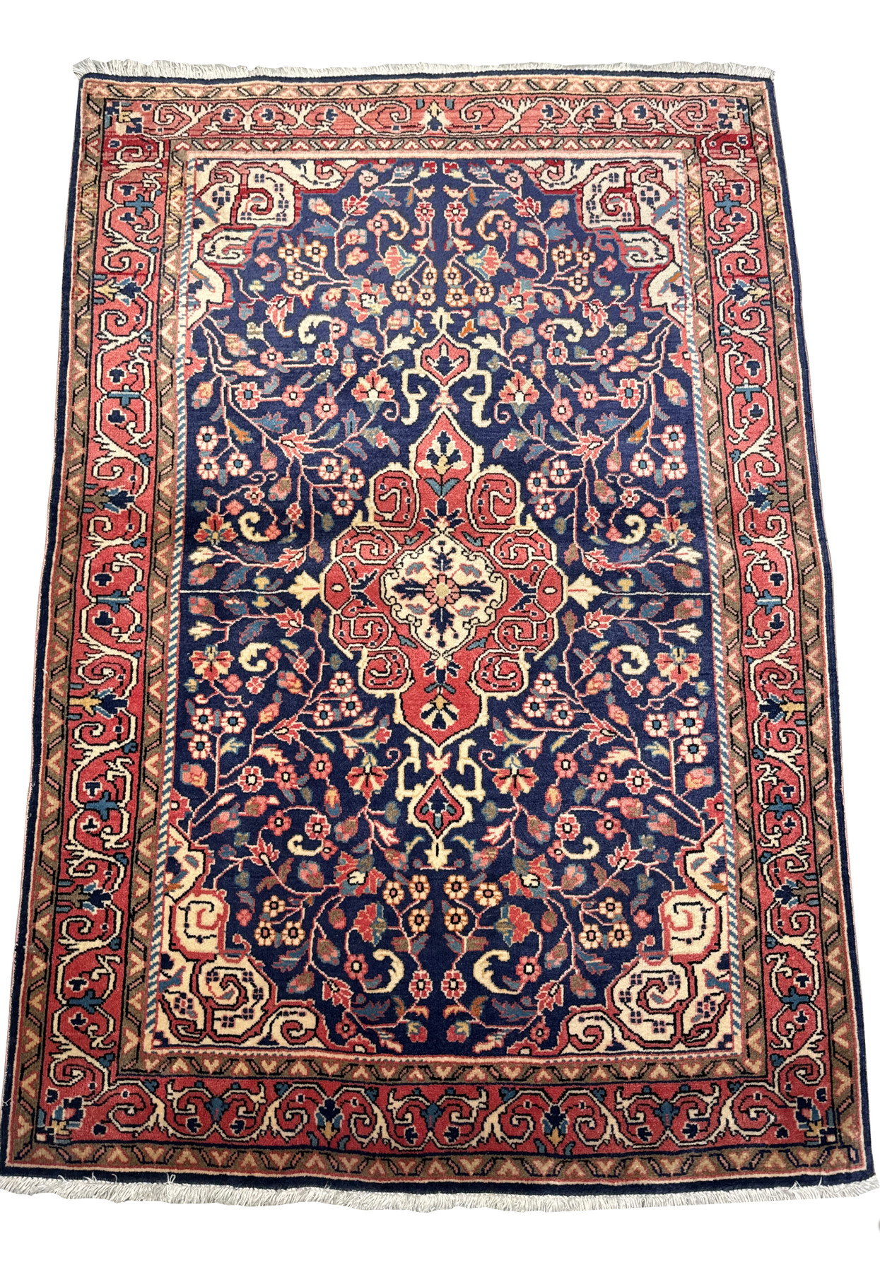 Close-up of the intricate central medallion design on a Vintage Persian Sarough Rug, showcasing the detailed floral patterns and vibrant colors