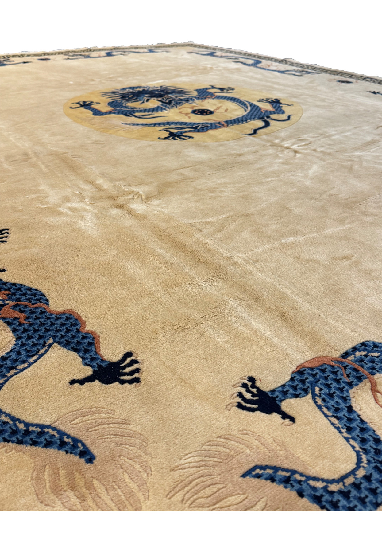 Side view of the Chinese Dragon Rug, showing the fringe edge and border pattern