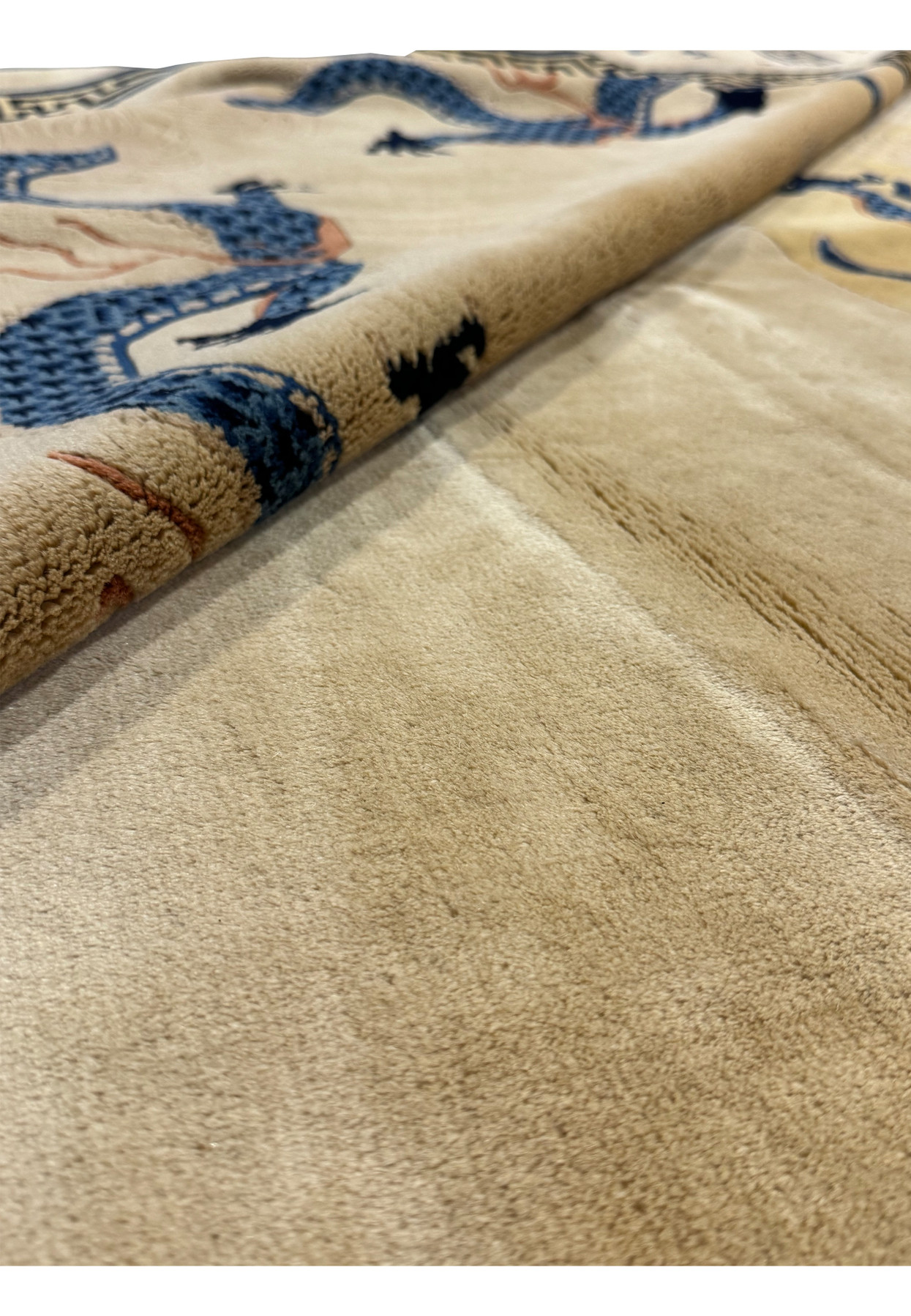 Angled perspective of the Chinese Beijing Dragon Rug, emphasizing the depth of the pile and rich color contrast