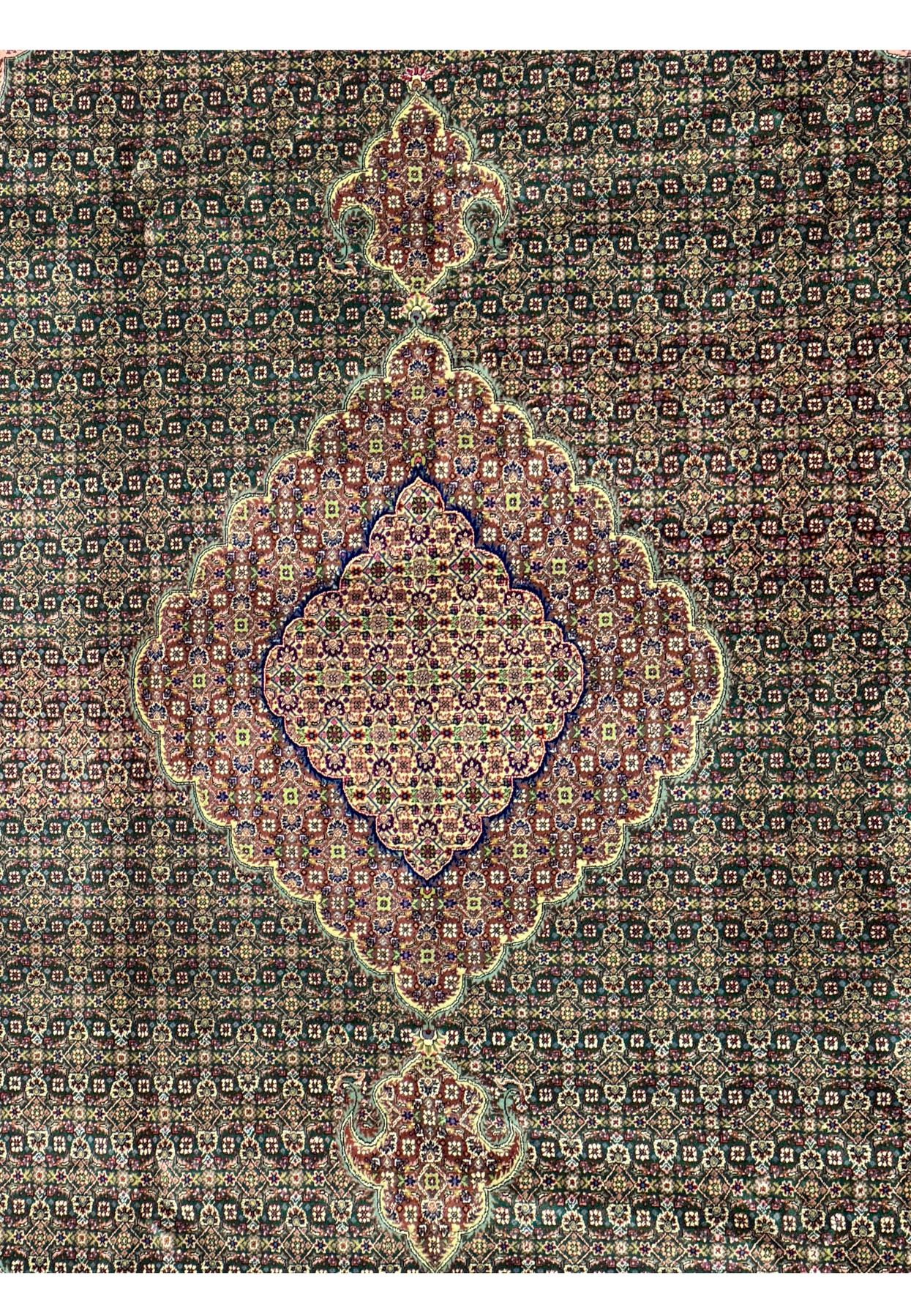 Close-up of the delicate silk and wool blend in a Persian Tabriz Mahi rug