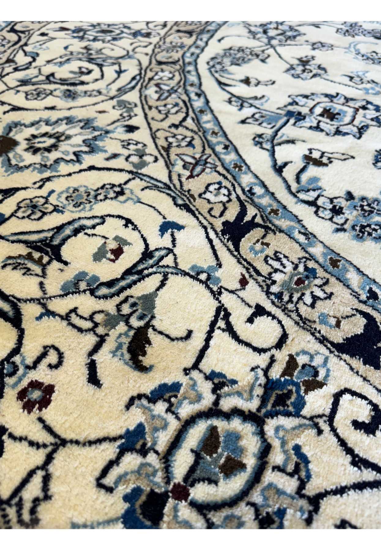 Opulent round Persian Nain rug with a luxurious pile and silk highlights