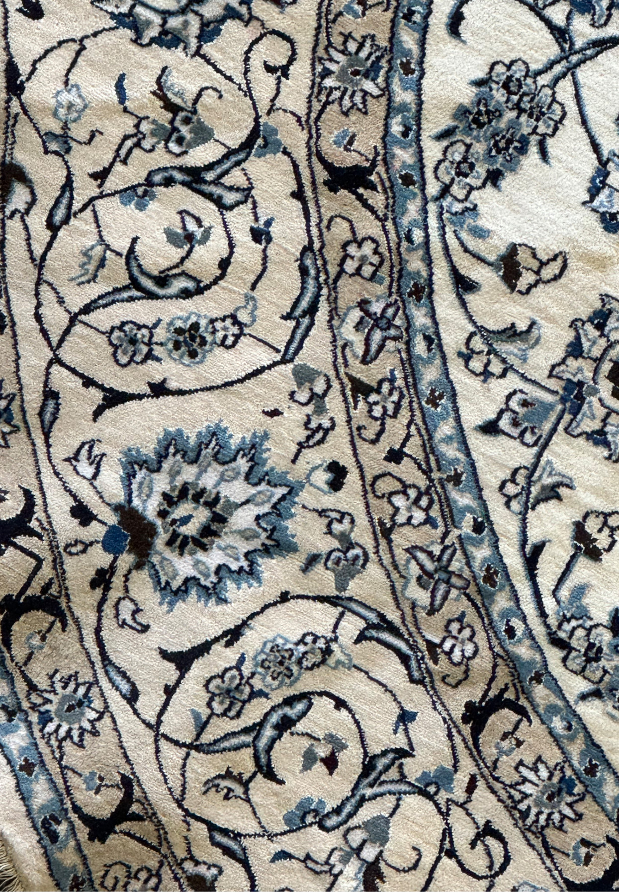 Sophisticated round Persian Nain rug with central medallion