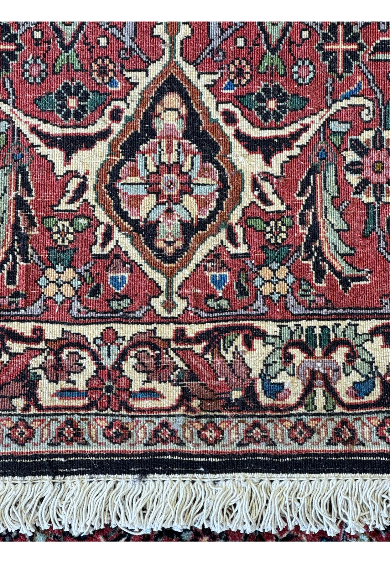 Zoomed-in view of the backside of a Persian Bidjar rug, showcasing the tight weave and exceptional knot quality that contribute to its designation as a high-quality wool rug