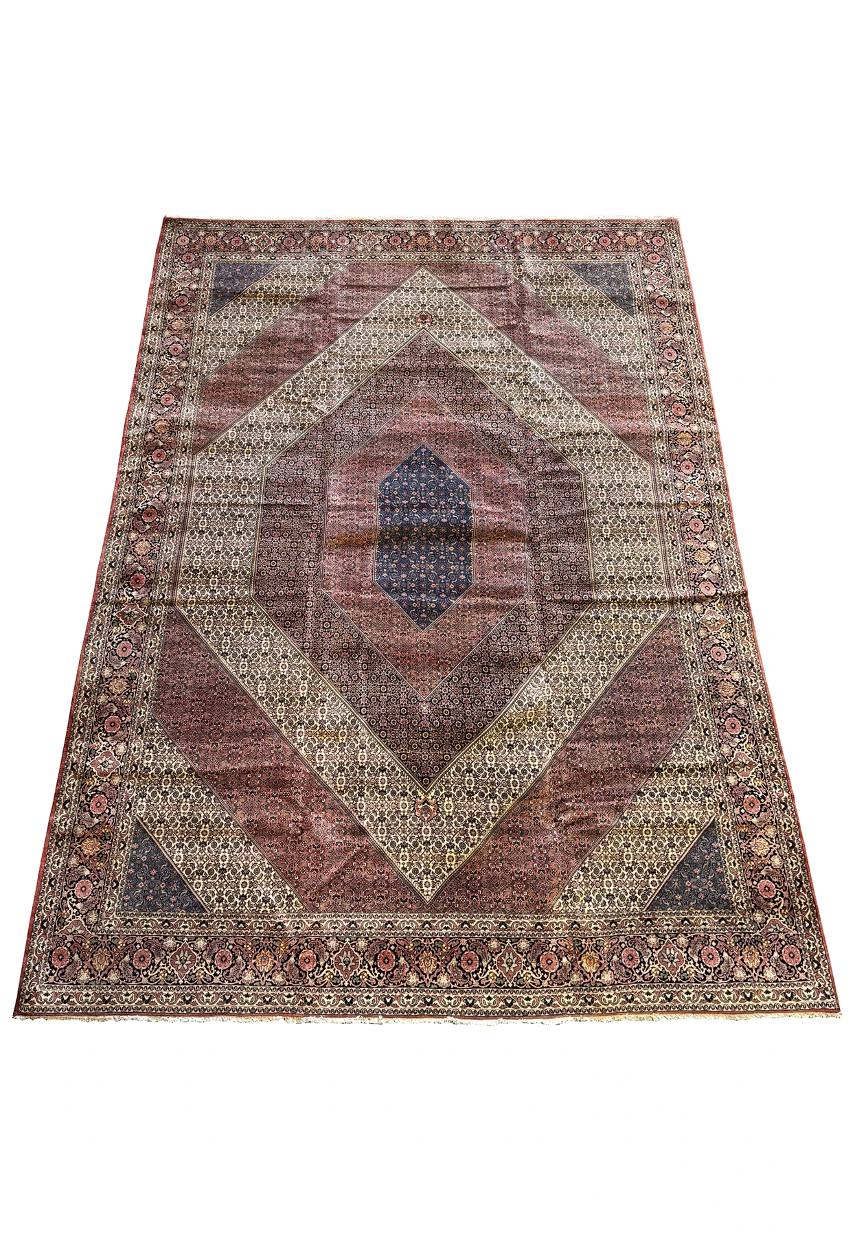 Overall view of a spacious Persian Bijar rug showcasing an elaborate mix of geometric and botanical designs with a standout central medallion.