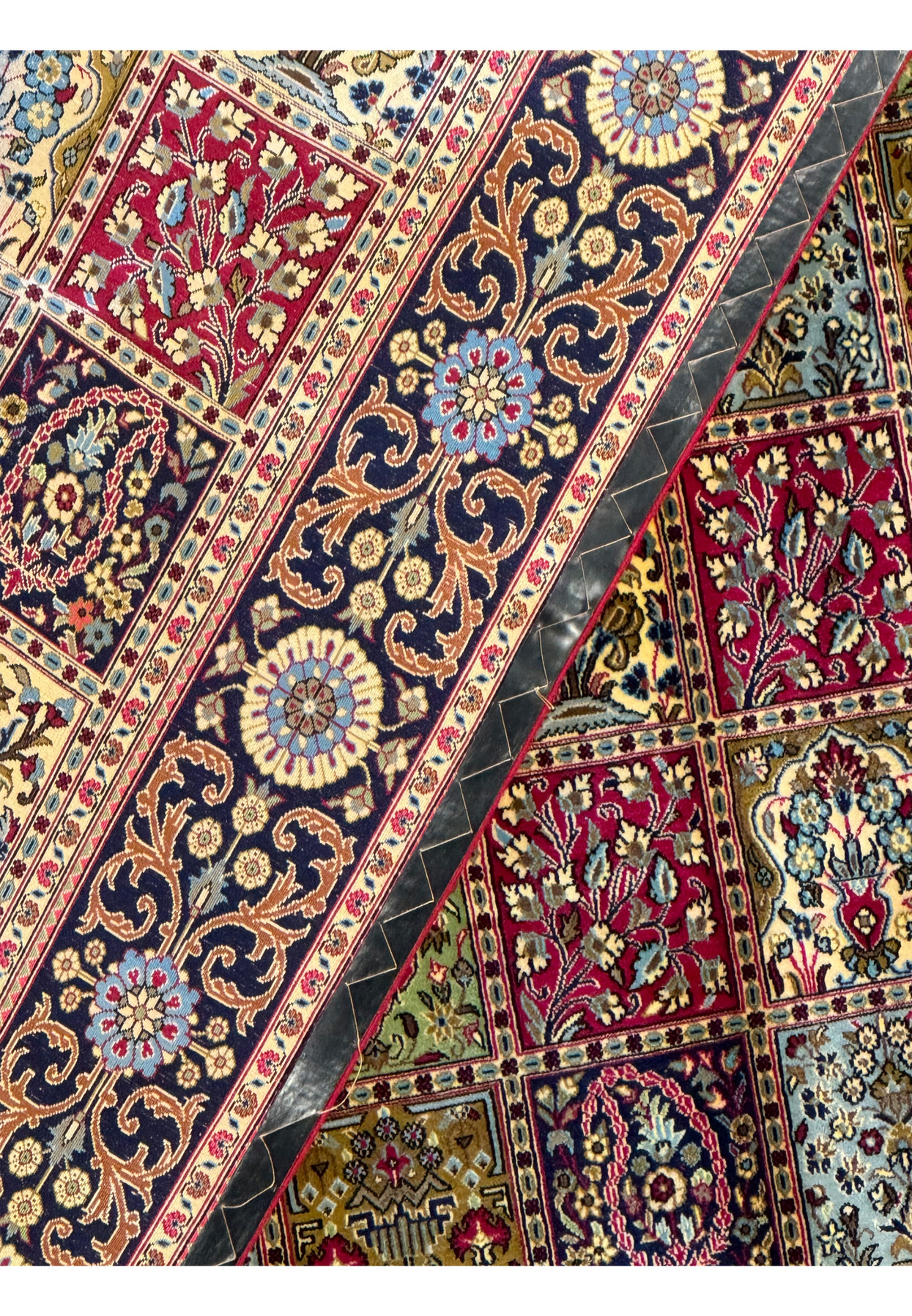 Backside detail of a Persian Qum Kork rug showcasing the tight knot structure and pattern clarity, indicative of high-quality craftsmanship