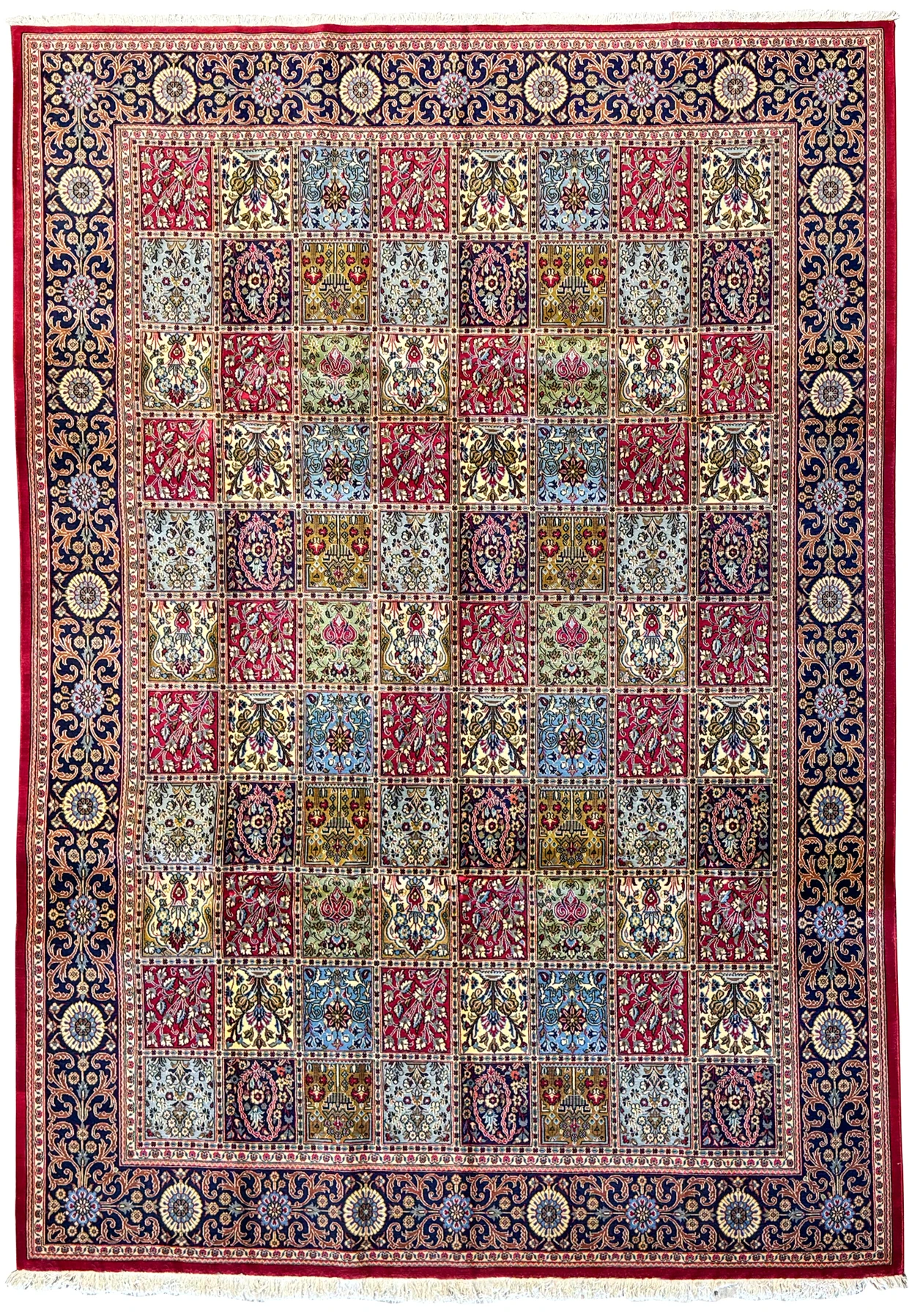 Detailed view of a handwoven Persian Qum Kork rug featuring an intricate panel design with navy blue, ivory, and crimson red squares, ideal for collectors and luxurious interiors