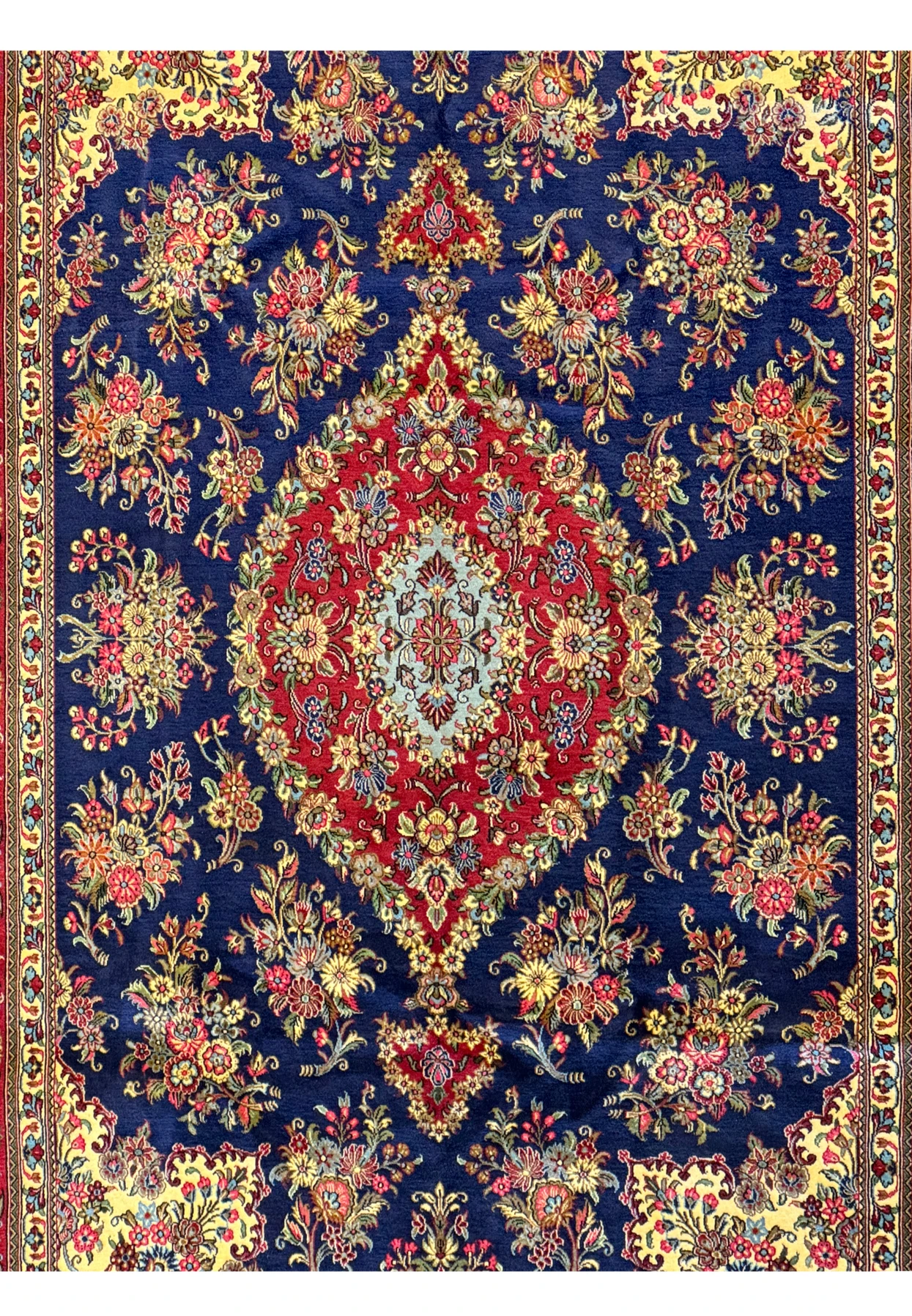 Top view of the Persian Qum Kork and Silk Rug, displaying the elaborate design and rich color palette with its detailed borders and expansive central medallion