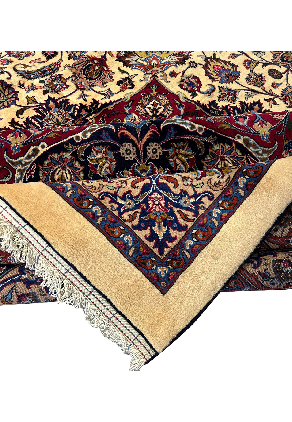 Close-up view of detailed floral motifs and intricate patterns on a Persian Mashad rug, showcasing vibrant colors such as red, blue, ivory, and gold, with meticulous craftsmanship and traditional Persian design elements