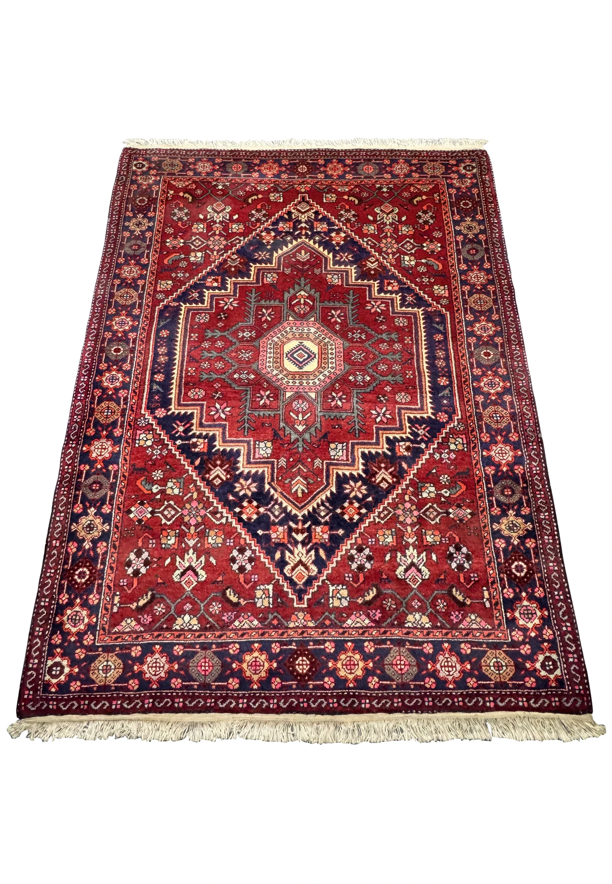 Close-up view of a 3'4" x 5'1" Persian Gholtogh Rug showcasing intricate geometric patterns and floral motifs in vibrant red, deep navy blue, and pastel colors. This high-quality hand-knotted rug features a central medallion design with detailed borders, highlighting the traditional Persian craftsmanship and rich cultural heritage