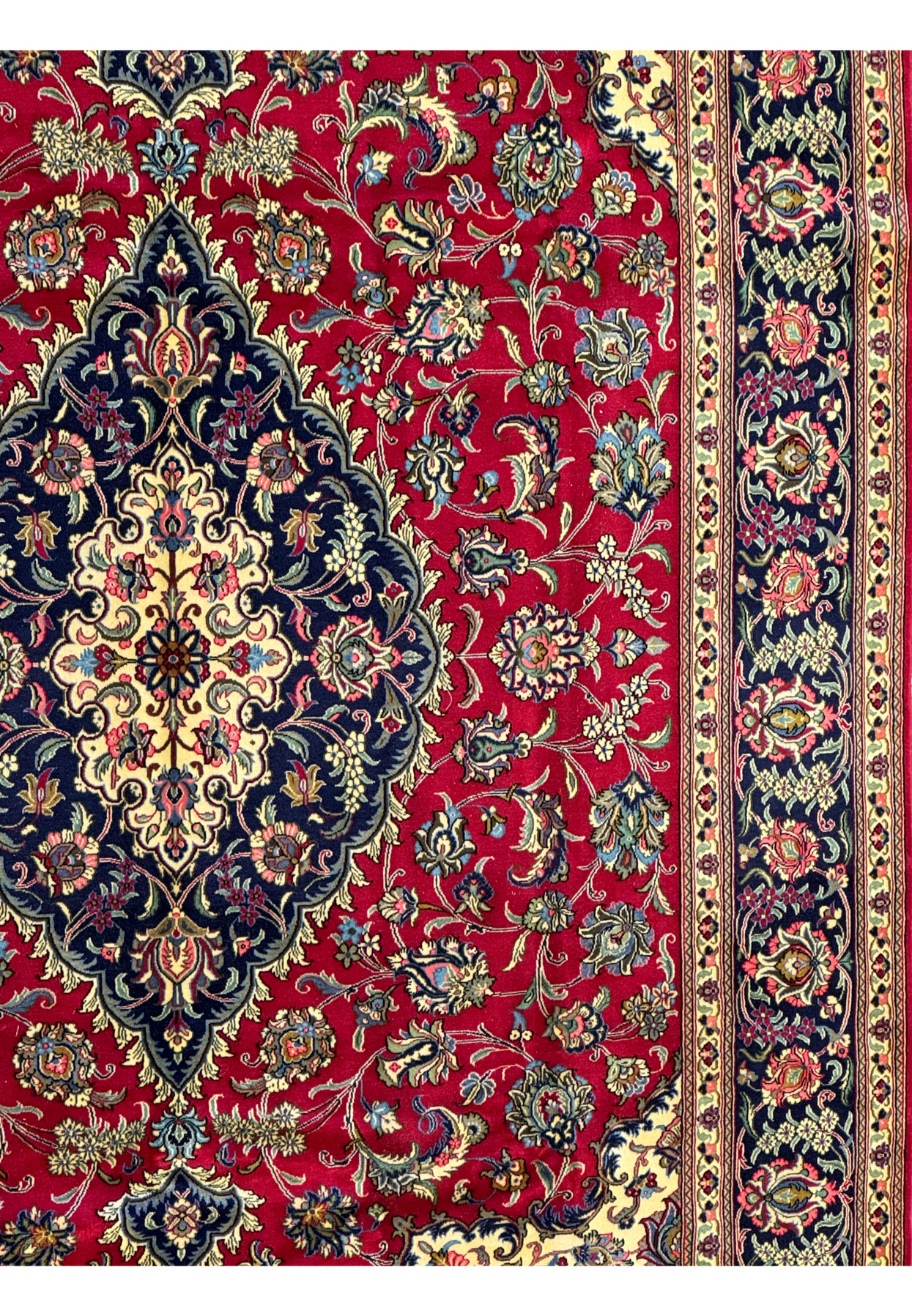 Side view of the Persian Qum Kork Rug, displaying the intricate floral patterns and borders with vine motifs.