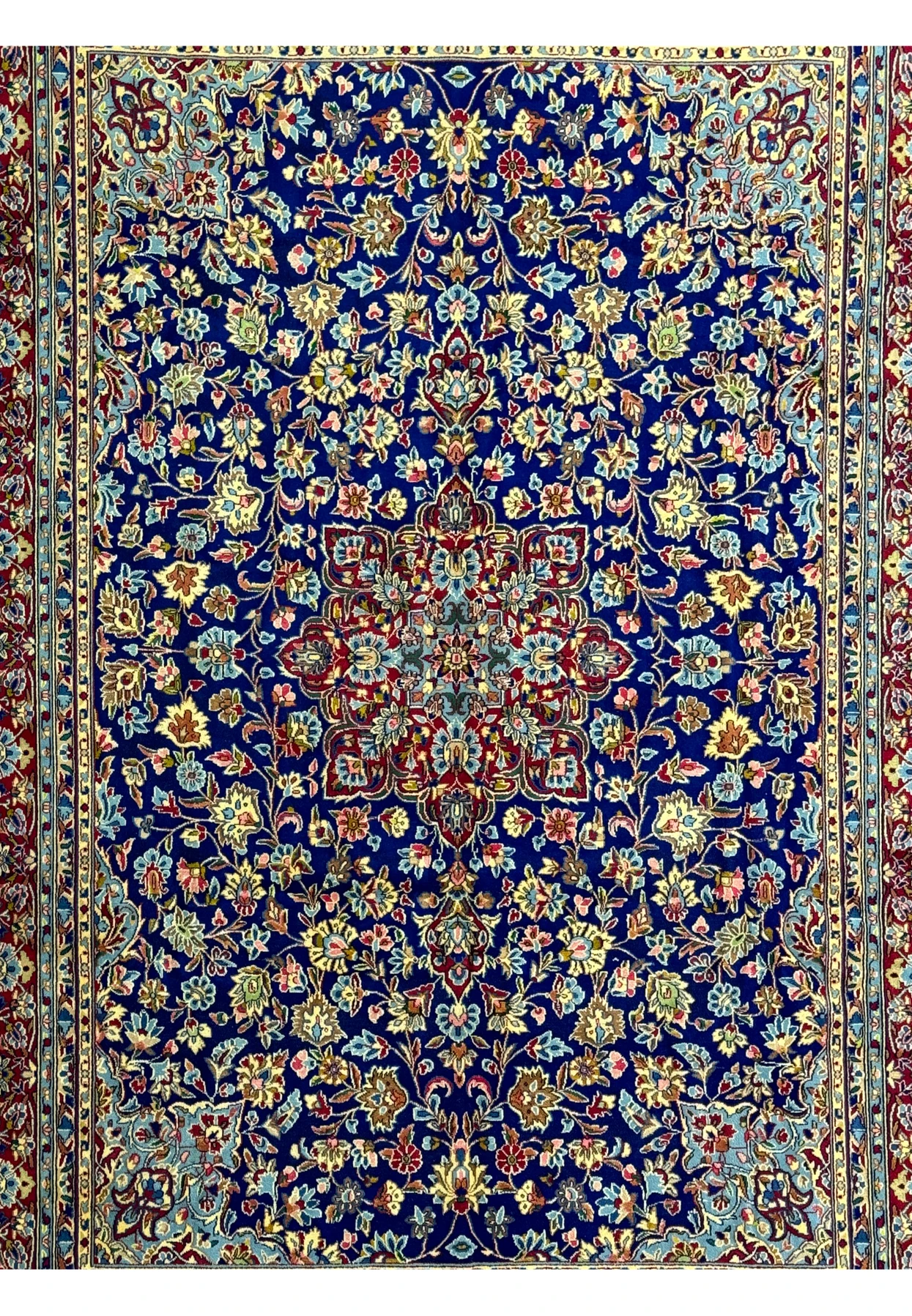 Focused view of the border on a Persian Kerman Rug, emphasizing the complementary floral motifs and the exquisite craftsmanship.