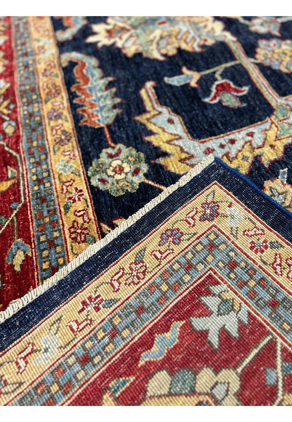 Close-up of the corner and edge of a handmade Ziegler rug, highlighting the craftsmanship and intricate details.