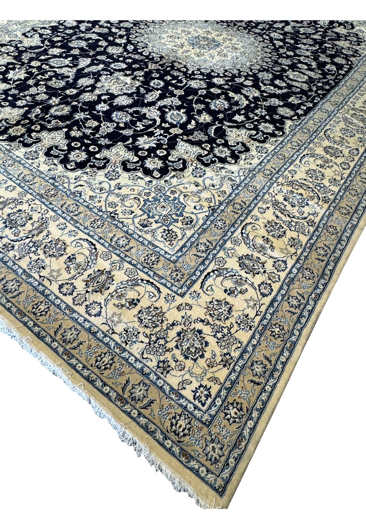 Side view of the 13x19 Nain Persian rug rolled up, emphasizing the high-quality wool and silk materials, detailed patterns, and rich colors, perfect for adding a touch of luxury to mansions and palaces