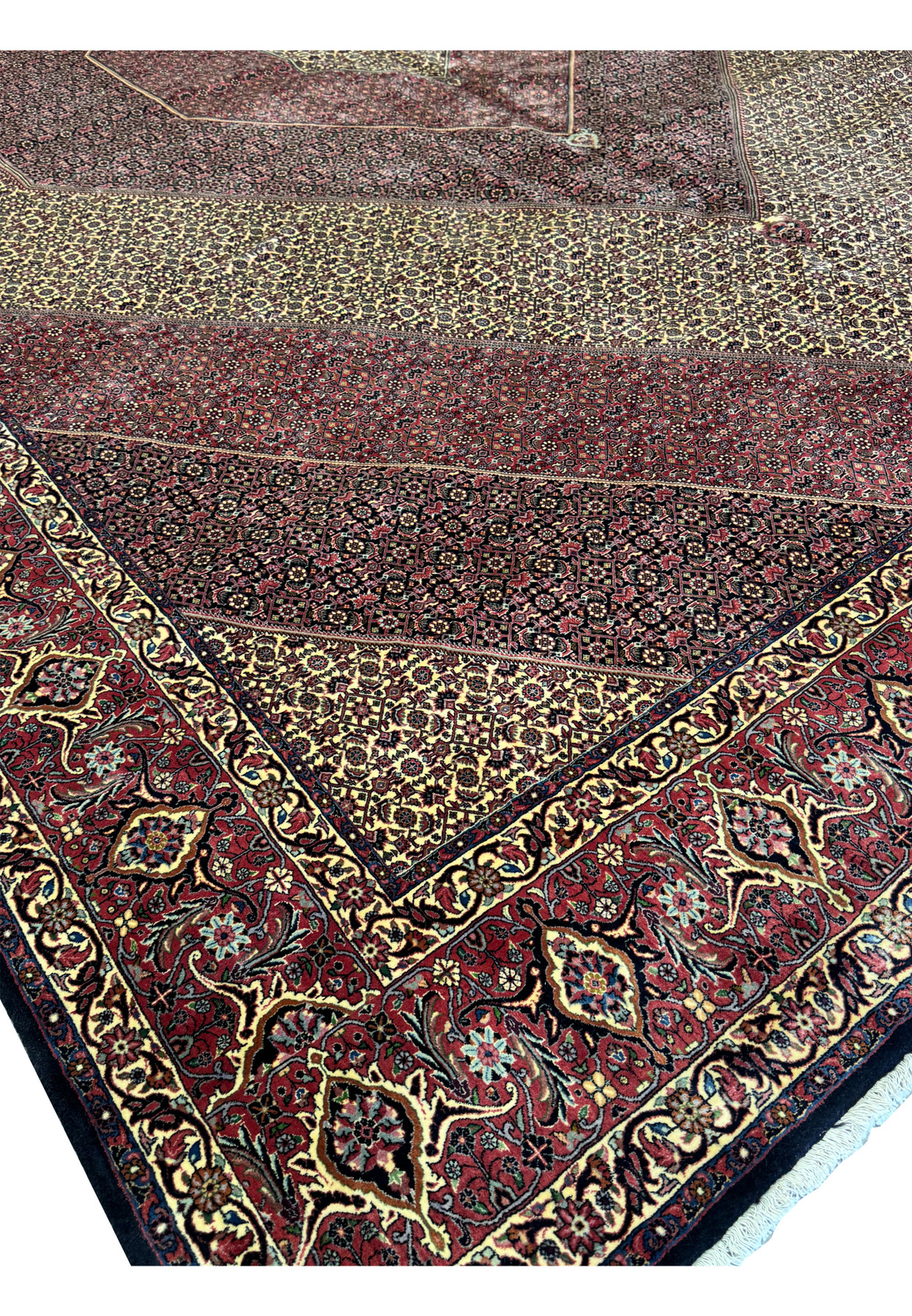 Top corner view of a 13x19'7 Persian Bijar Rug with intricate medallion and border patterns.