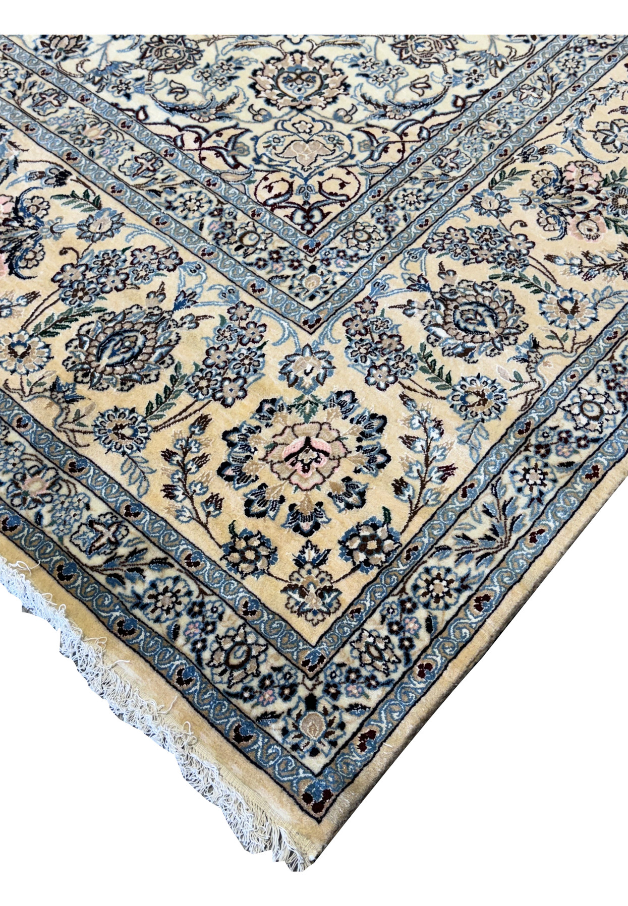 Corner view focusing on the fringe and border details of a Persian Nain 9LAA Wool & Silk Rug.