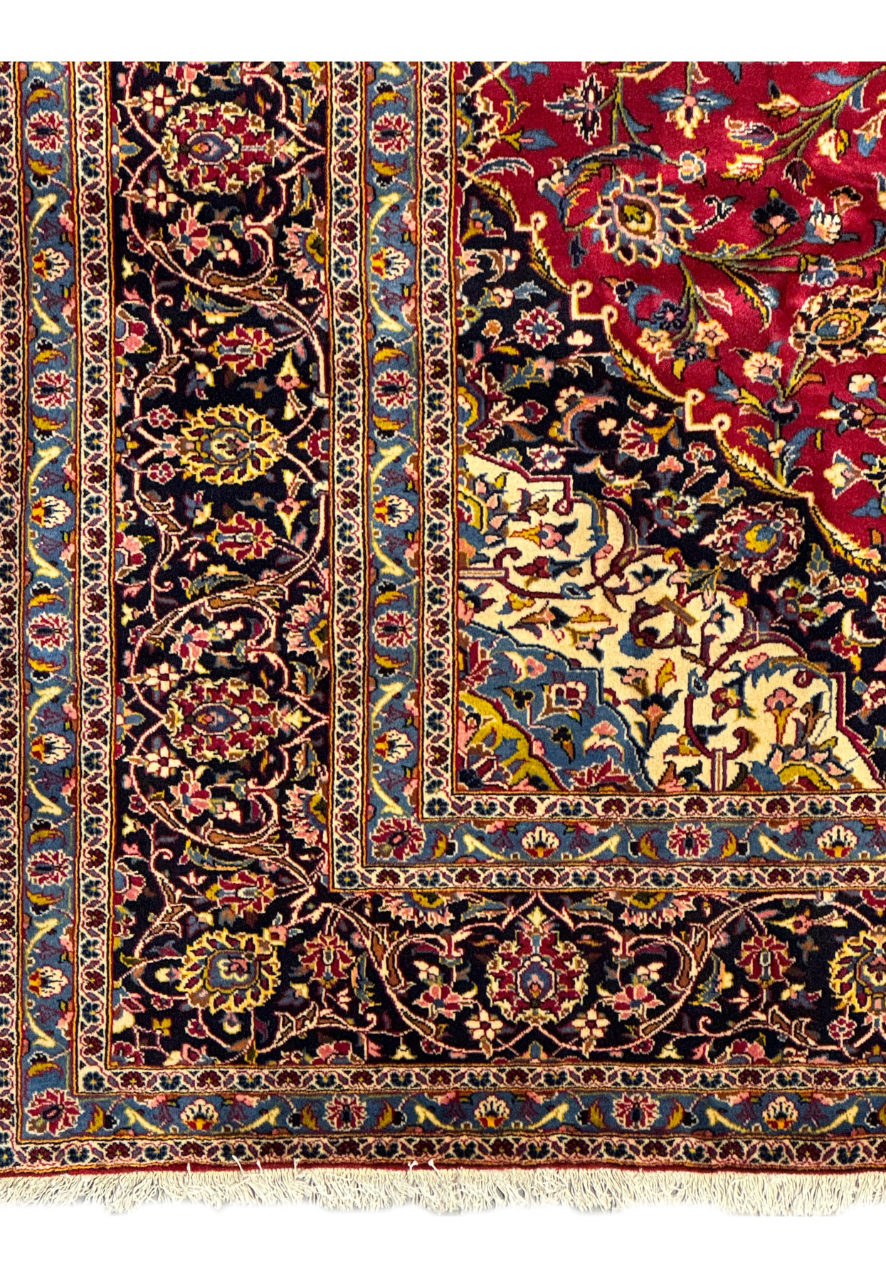 Close-up of the fringe and edge of a Persian Kashan Rug, showing high-quality cotton foundation and wool pile.
