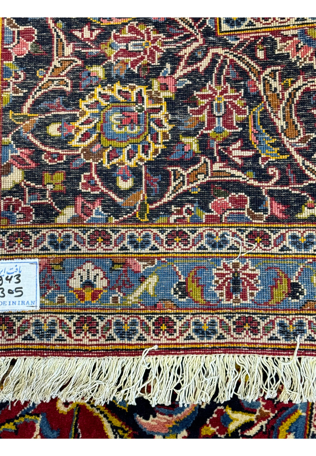 Detailed view of the backside of a Persian Kashan Rug, revealing the knot density and weaving technique.
