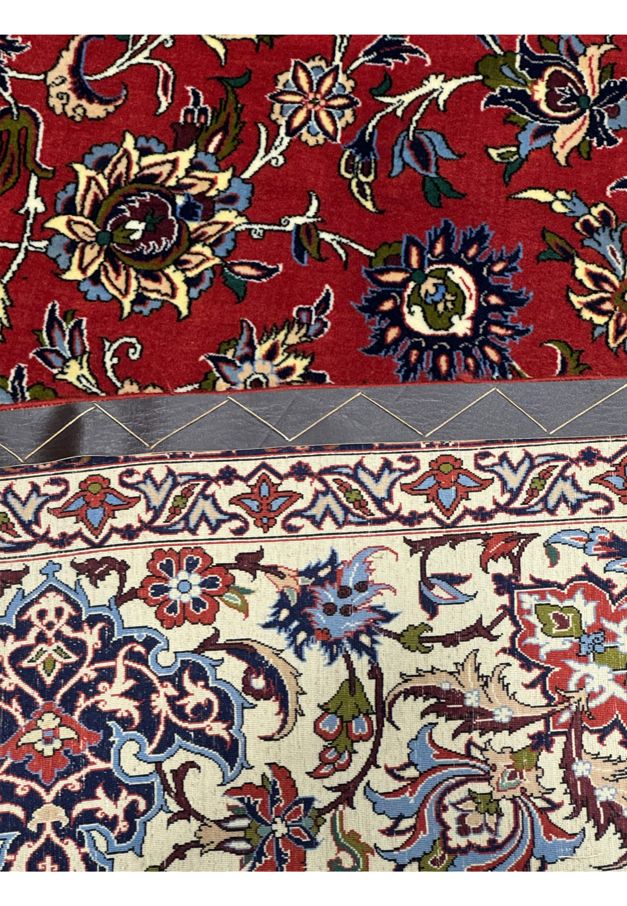 Detailed view of floral motifs on the back of Persian Isfahan Silk Rug.