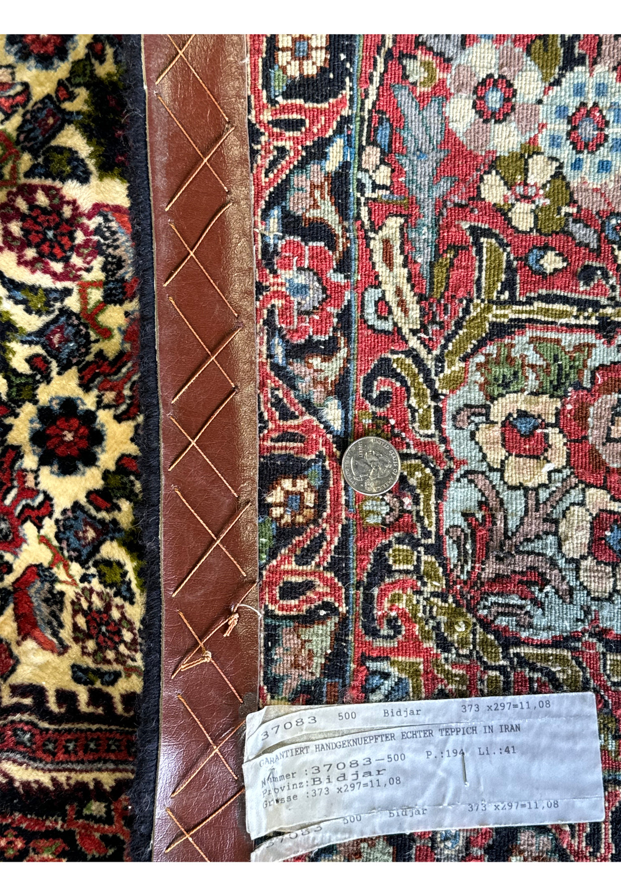 Back of the rug sowing the label and metric size of the 9x12 Bijar Rug