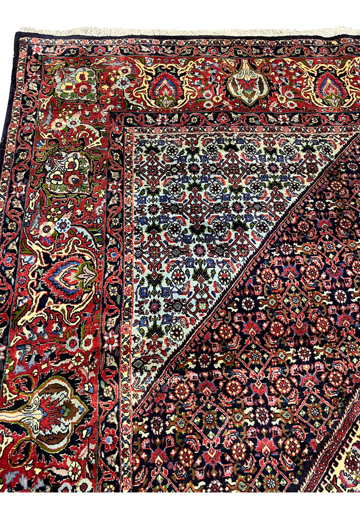 Inner border of a Persian Bijar rug displaying fine geometric detailing, ivory accents, dark navy outlines, and precise hand-knotting with high structural density.