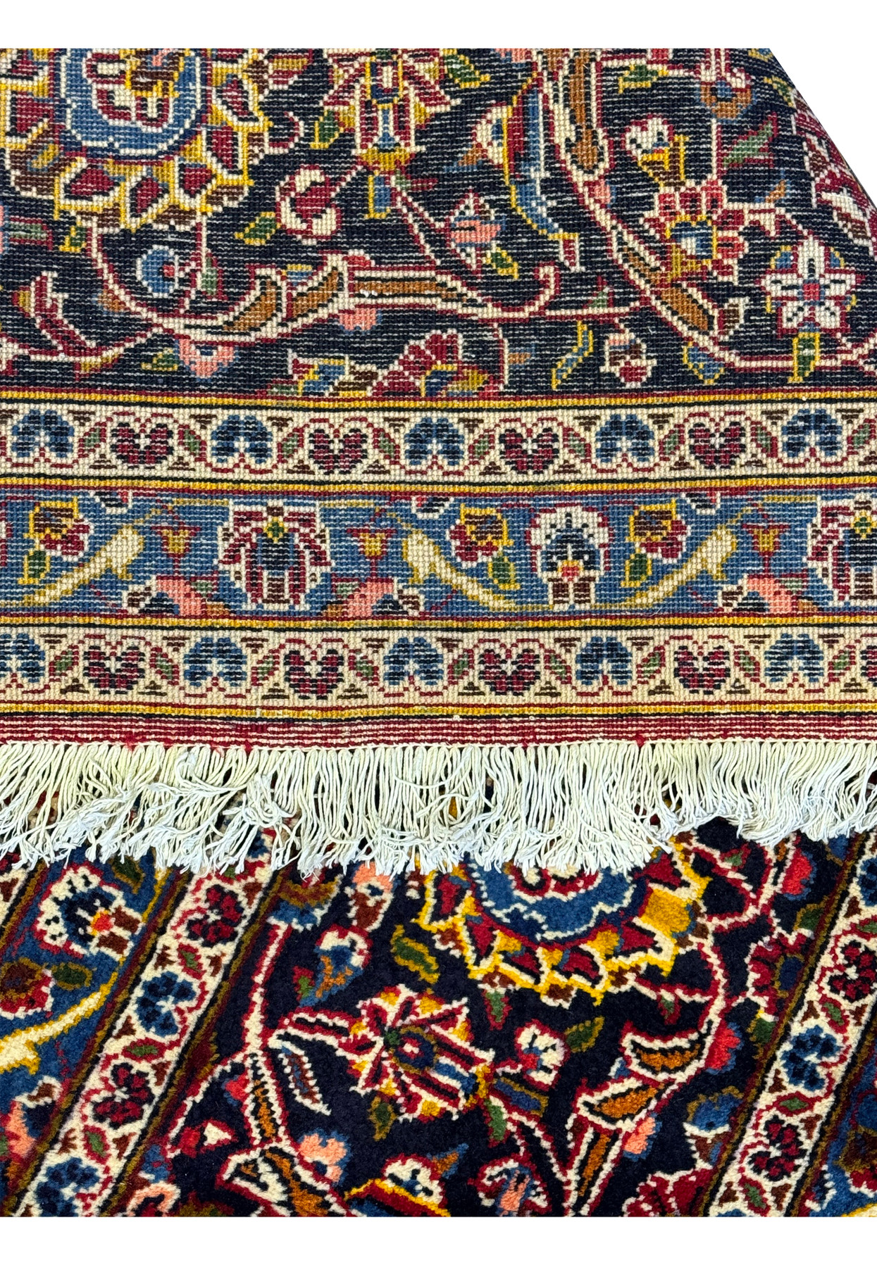 Edge detail of the Persian Kashan Rug with visible fringe and intricate border design.