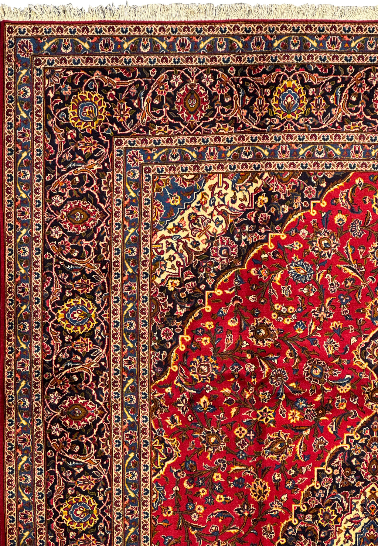 Corner section of the Persian Kashan Rug displaying the detailed border patterns and rich color palette.