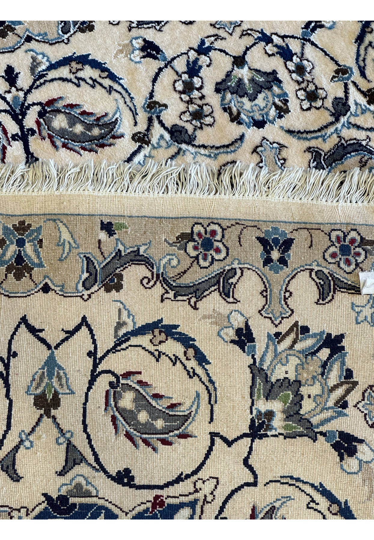 Back view of the 6'8 x 10'4 Persian Nain 9LAA Wool & Silk Rug, showcasing the detailed knotting and craftsmanship