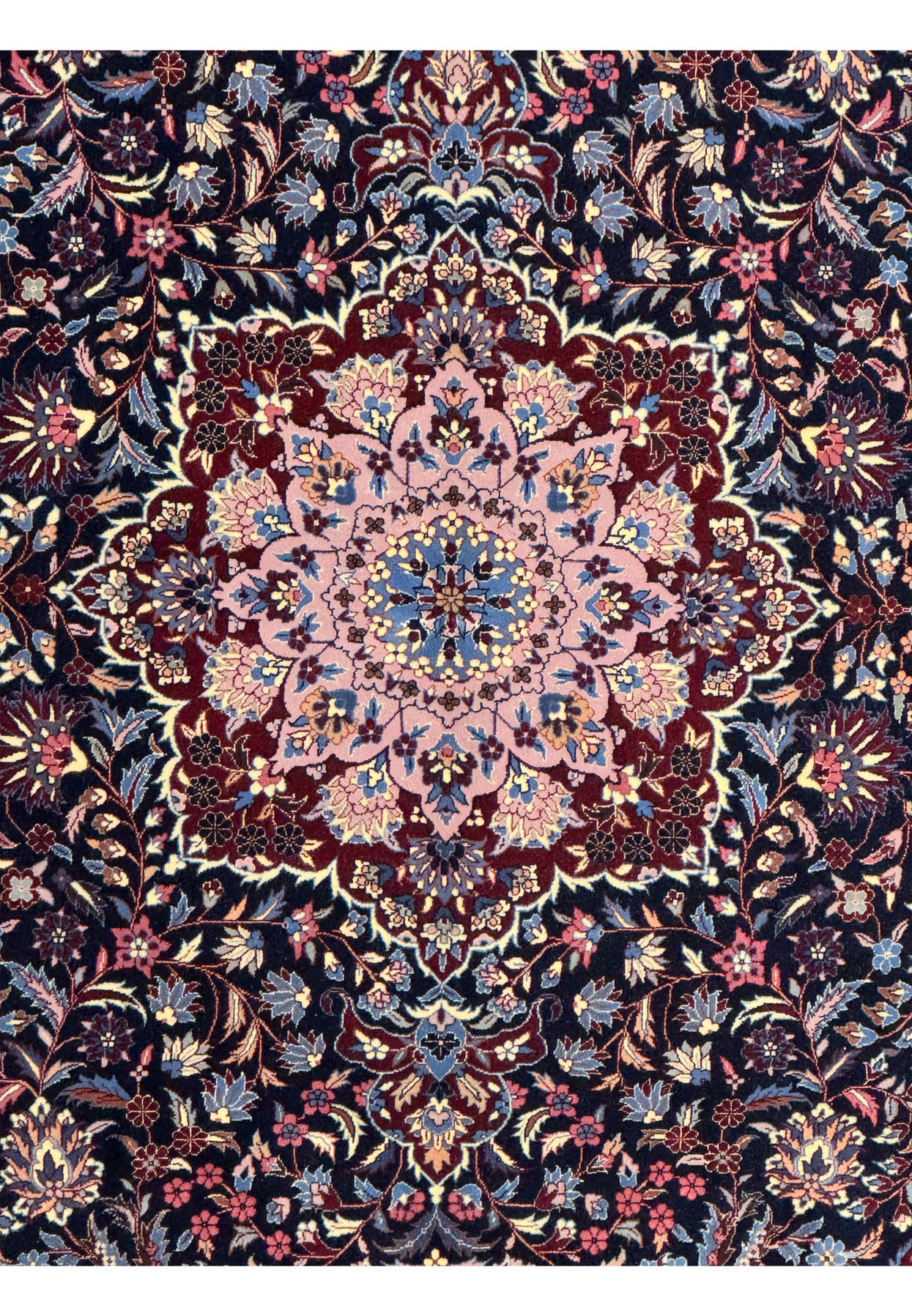 Close-up of the medallion in the center of an 6'2 x 9'6 Persian Isfahan Wool and Silk Rug highlighting intricate design and vibrant colors.