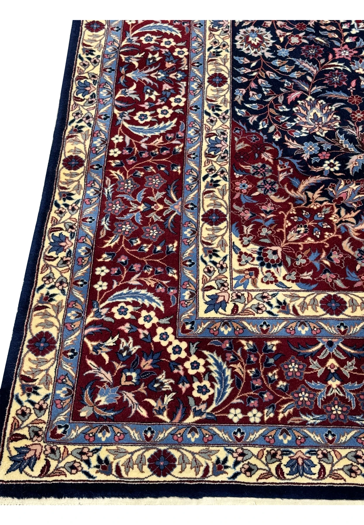 Border of this 6xi Isfahan Persian Rug mixing a harmonious mix of blues, reds, ivories.