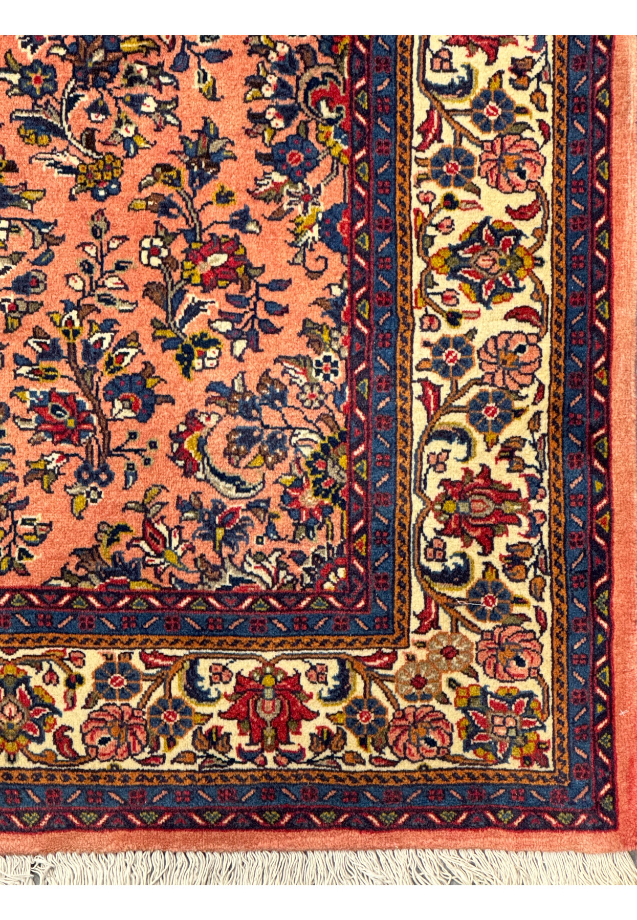 Side view of the 5'6" x 8'5" Persian Sarouk rug emphasizing the pattern and texture.