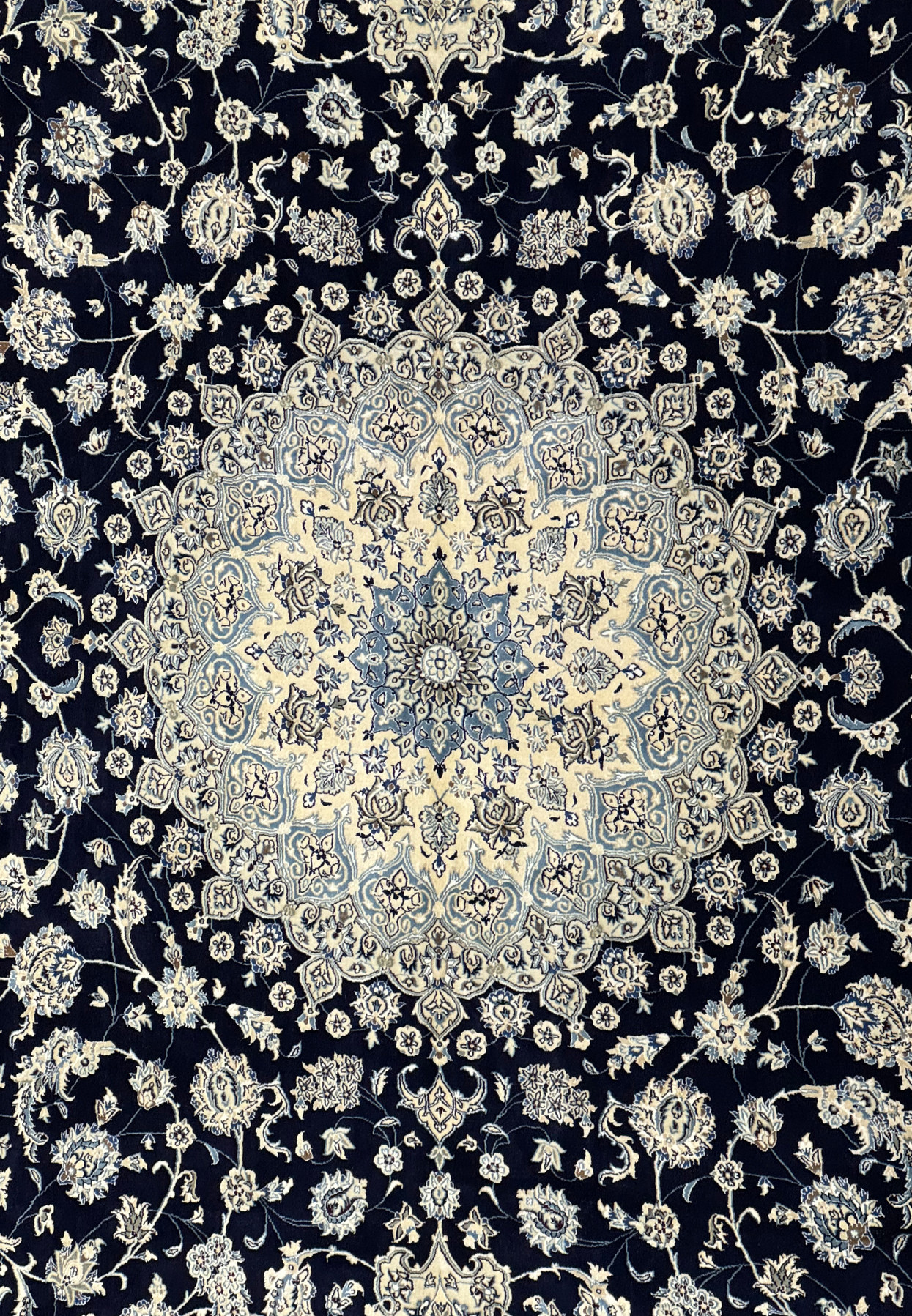 Detail of the central medallion on the 13 x 19'8 Persian Nain Rug, highlighting fine weaving.