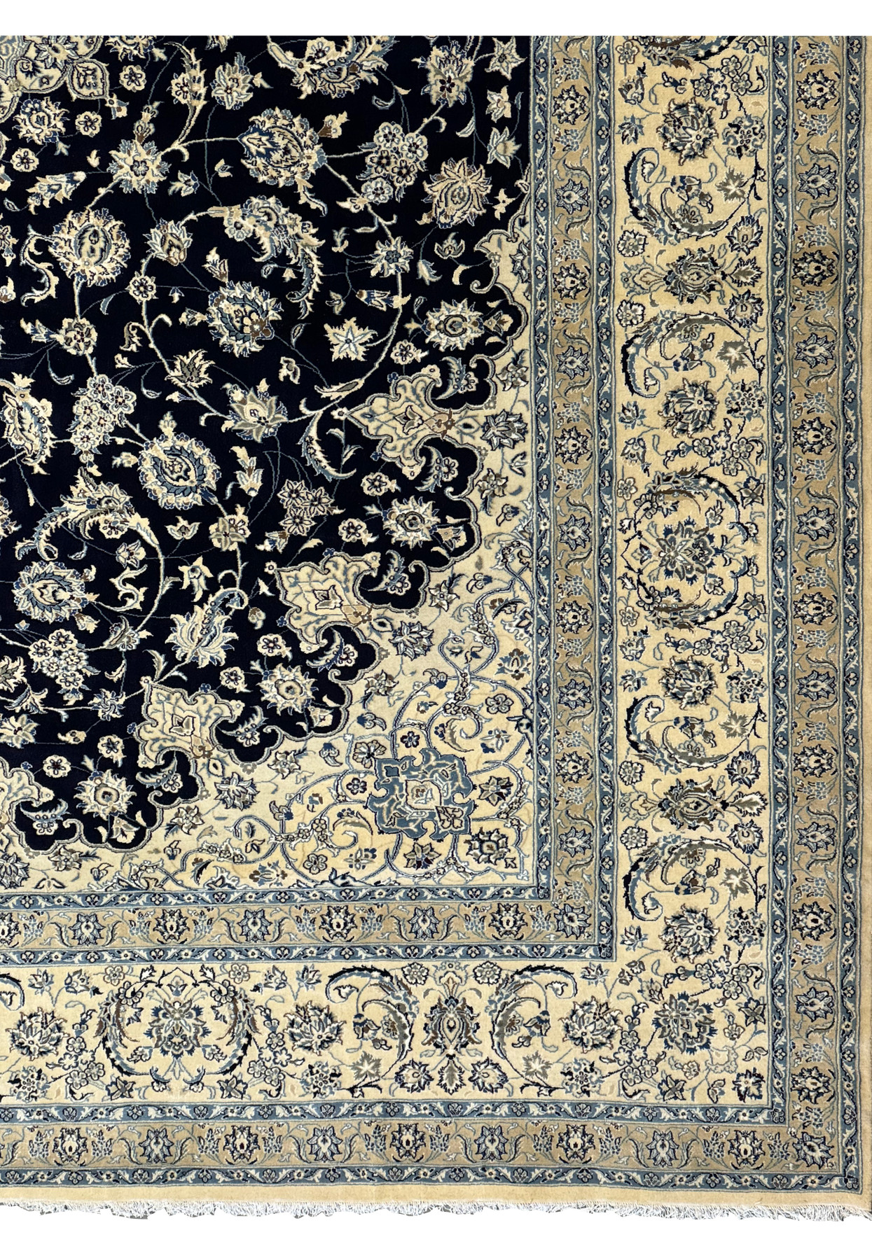 Close-up of the fringe and corner details on the 13 x 19'8 Persian Nain Rug