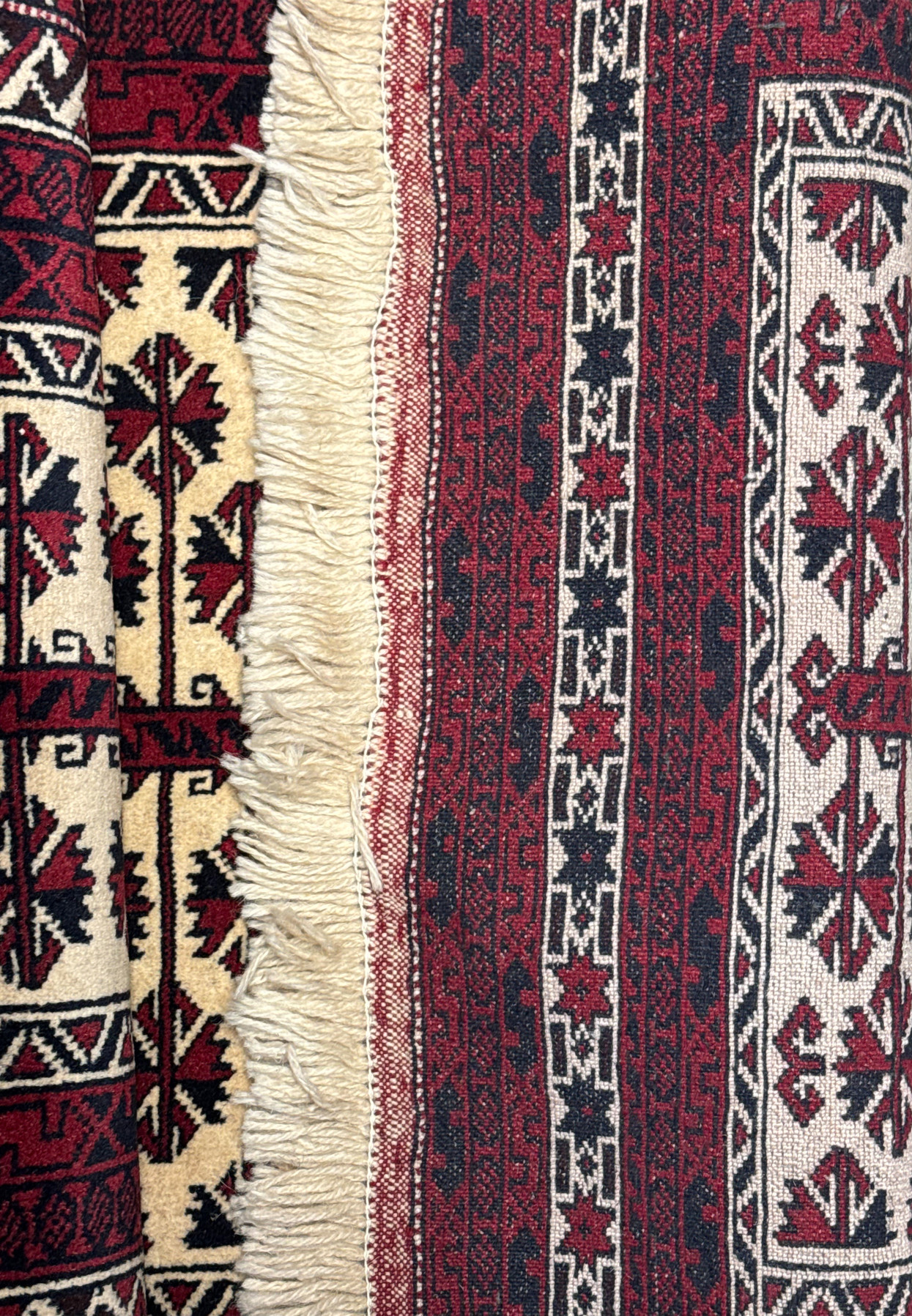 Backview of the 3'1 x 4'2 Persian Baluch rug showing the nomadic weaving technique