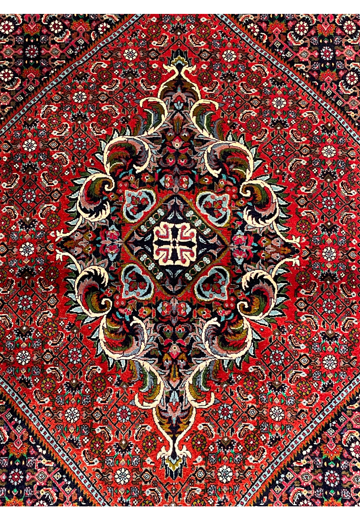 Close-up of central medallion on Persian Bijar Rug showcasing detailed motifs.