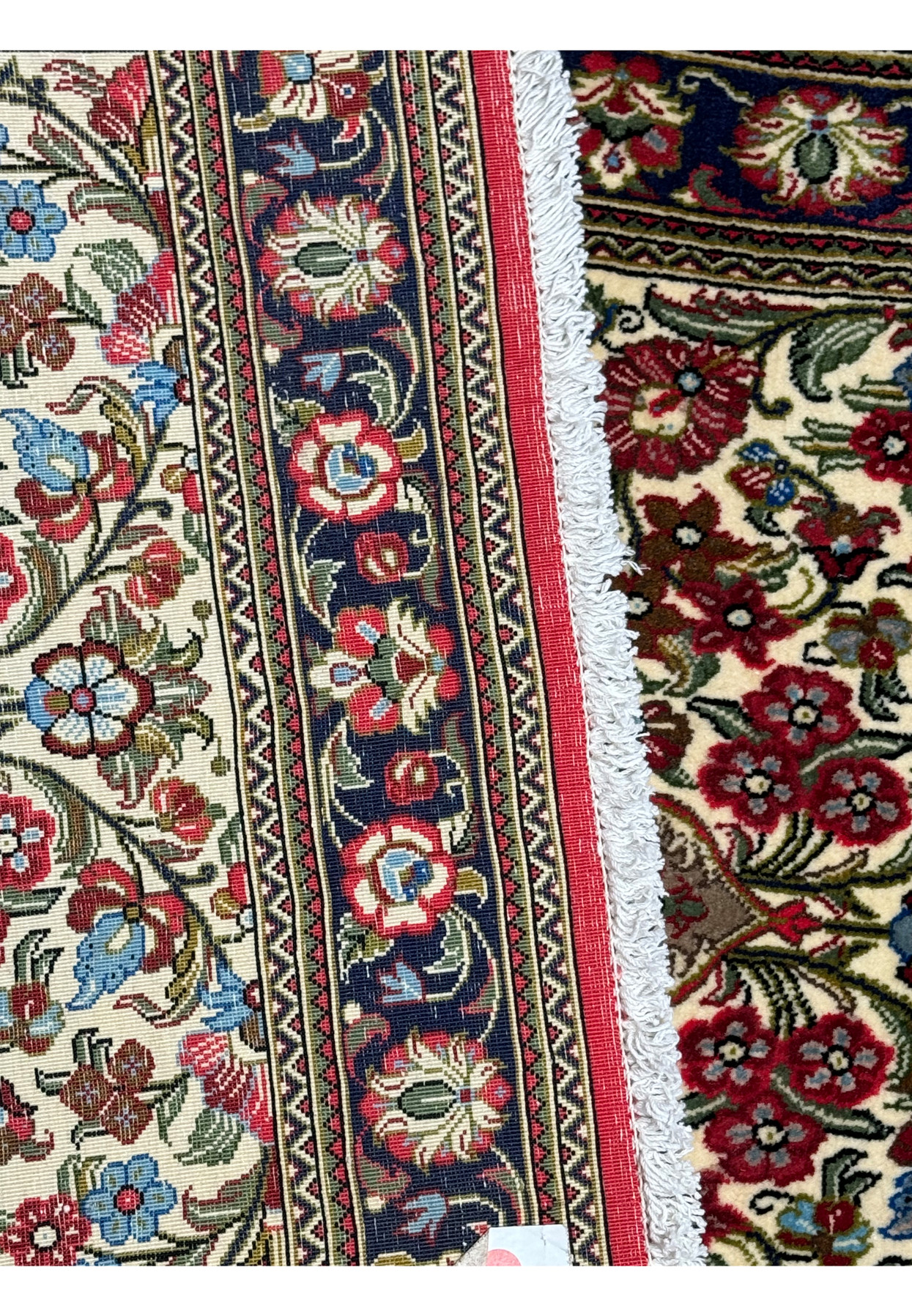 Backside High-quality Kork wool used in a Persian Qum rug with vibrant colors