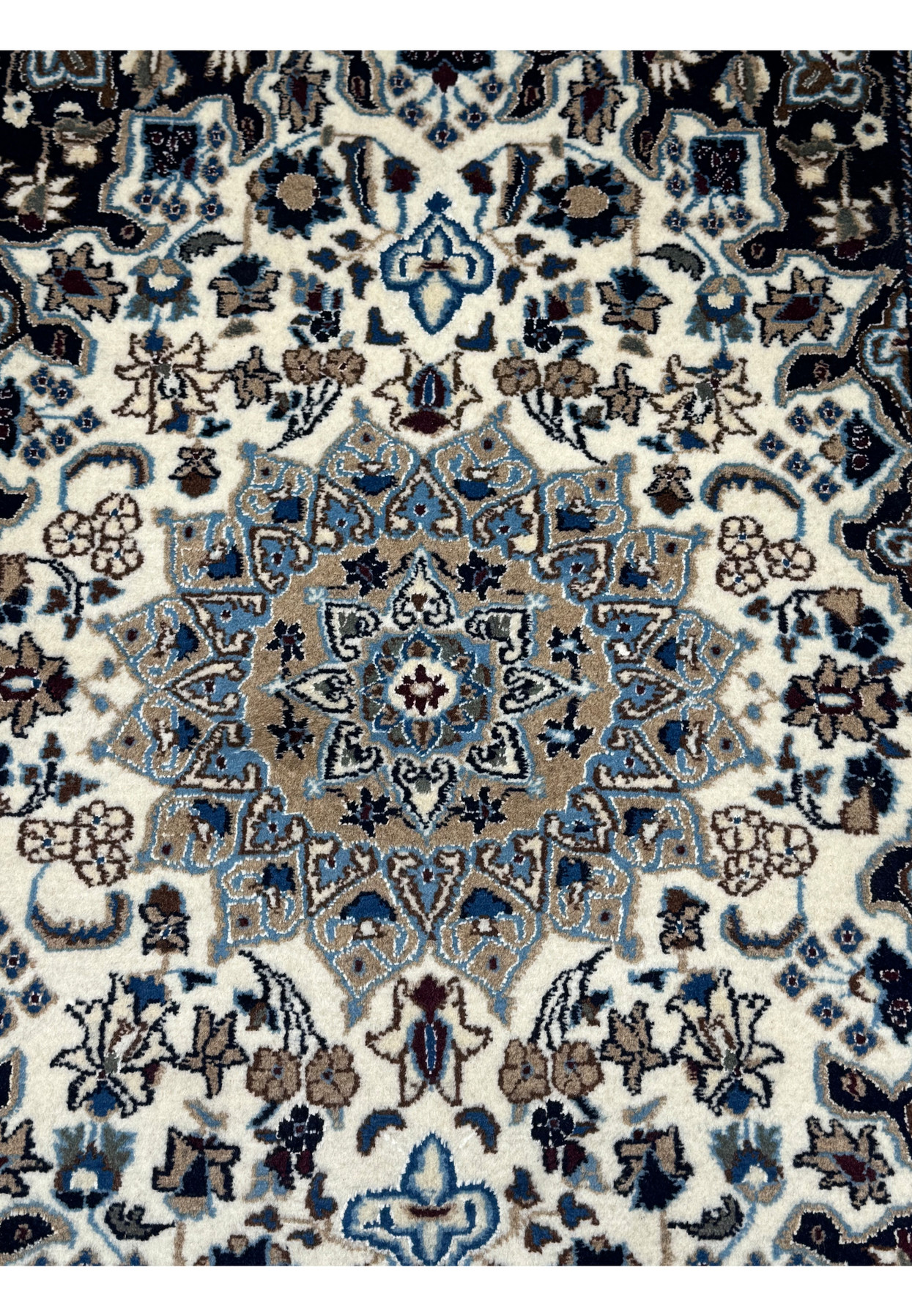 Close-up of the central medallion on a 3 x 4'5 Nain Persian Rug.