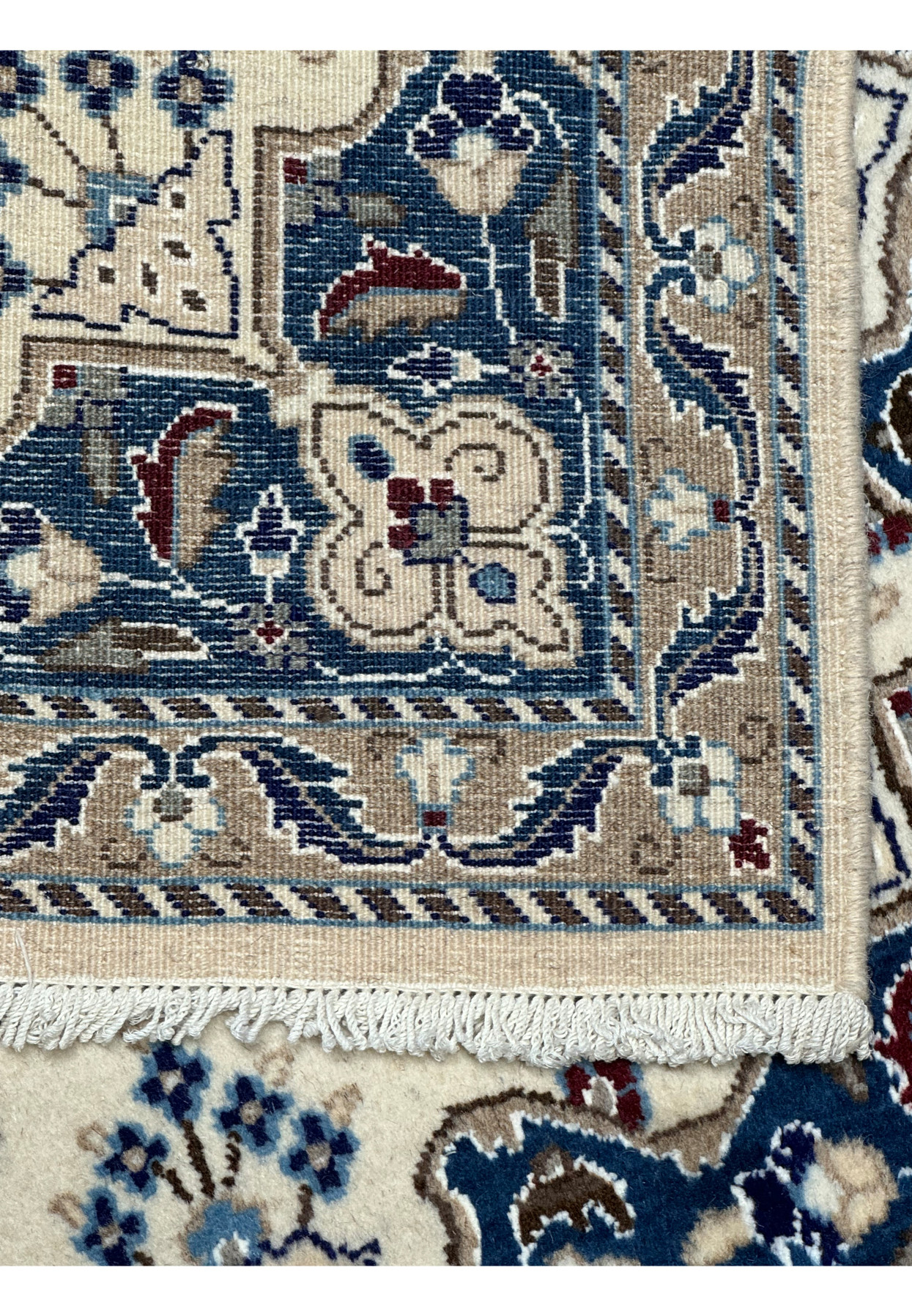 Backside of a 2'10 x 4'8 Persian Nain Rug displaying high-quality hand-knotting.