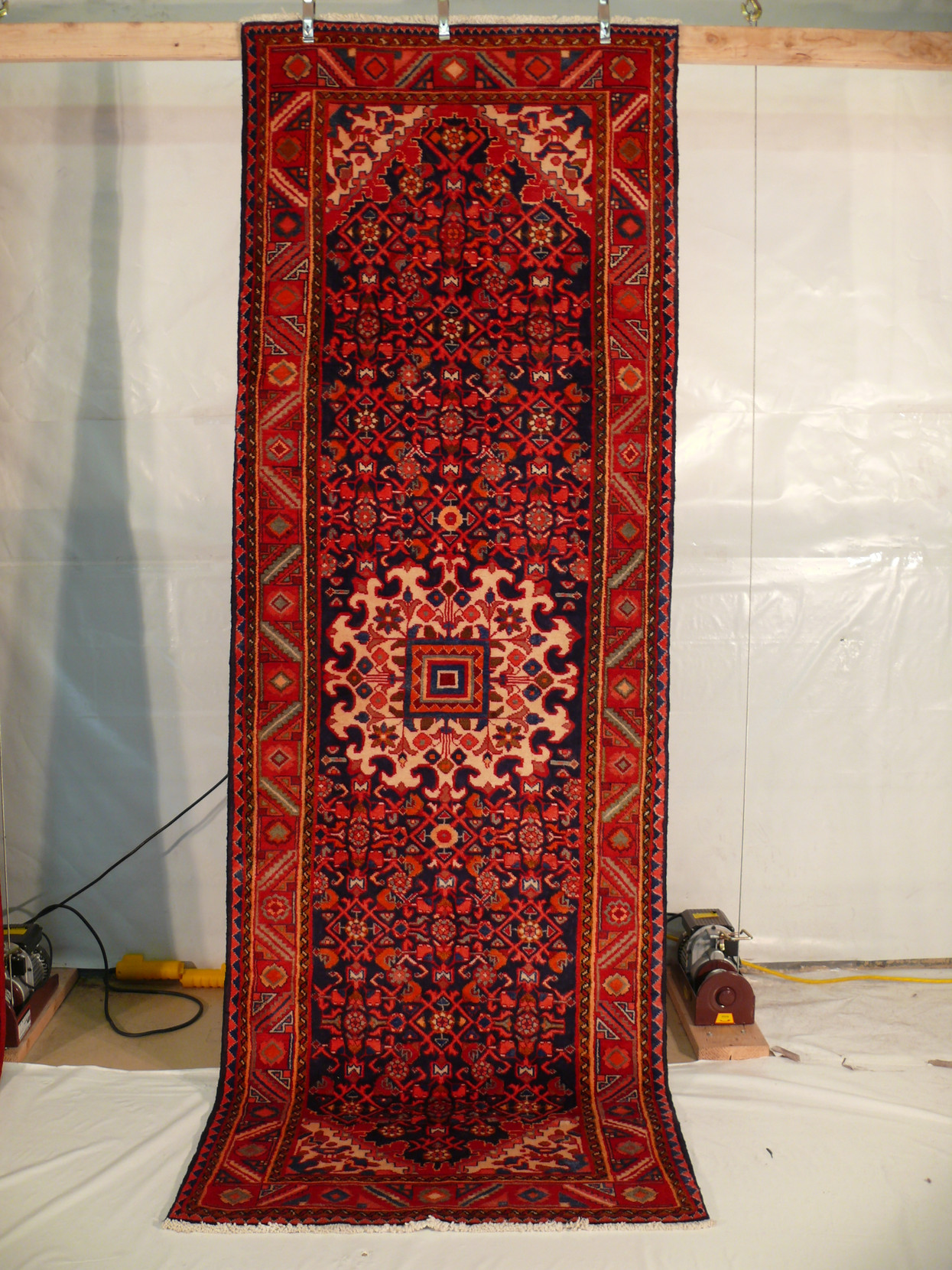 3'6 x 10'6 Persian Hamedan Runner displayed hanging showcasing intricate design and vibrant colors.