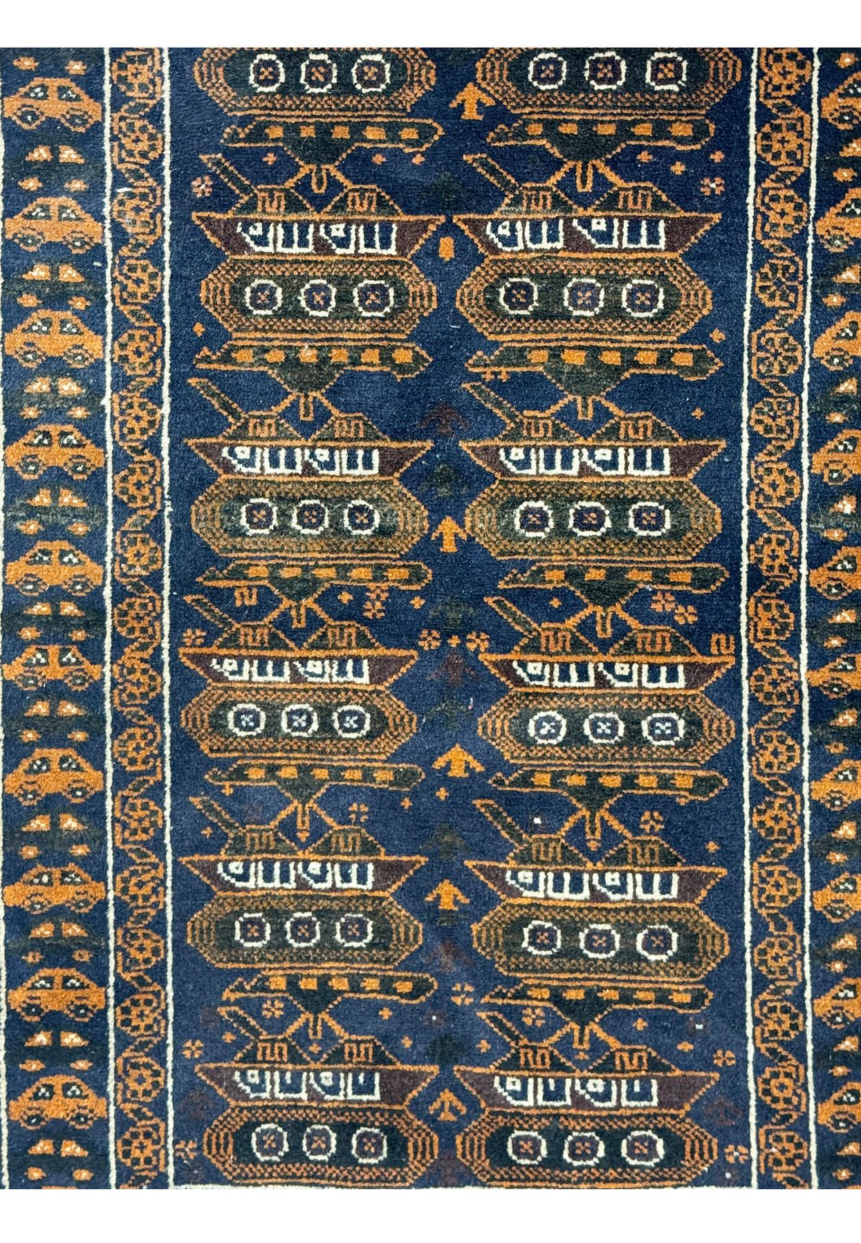 Close-up of the midfield of a 2'9 x 4'4 Persian Baluch Rug highlighting the tank motifs and geometric patterns.