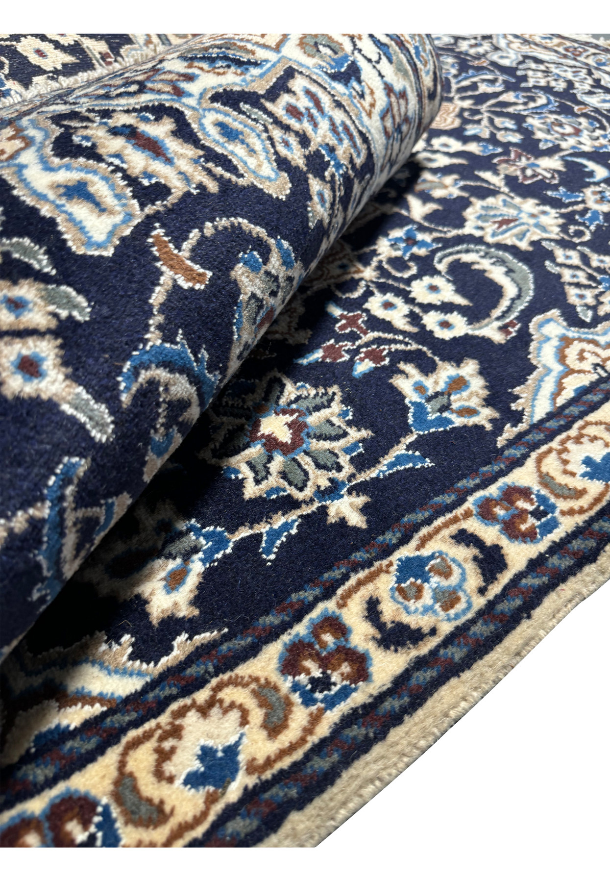Rolled view of the 3x5'3 Persian Nain Rug highlighting its thickness and high-quality wool.