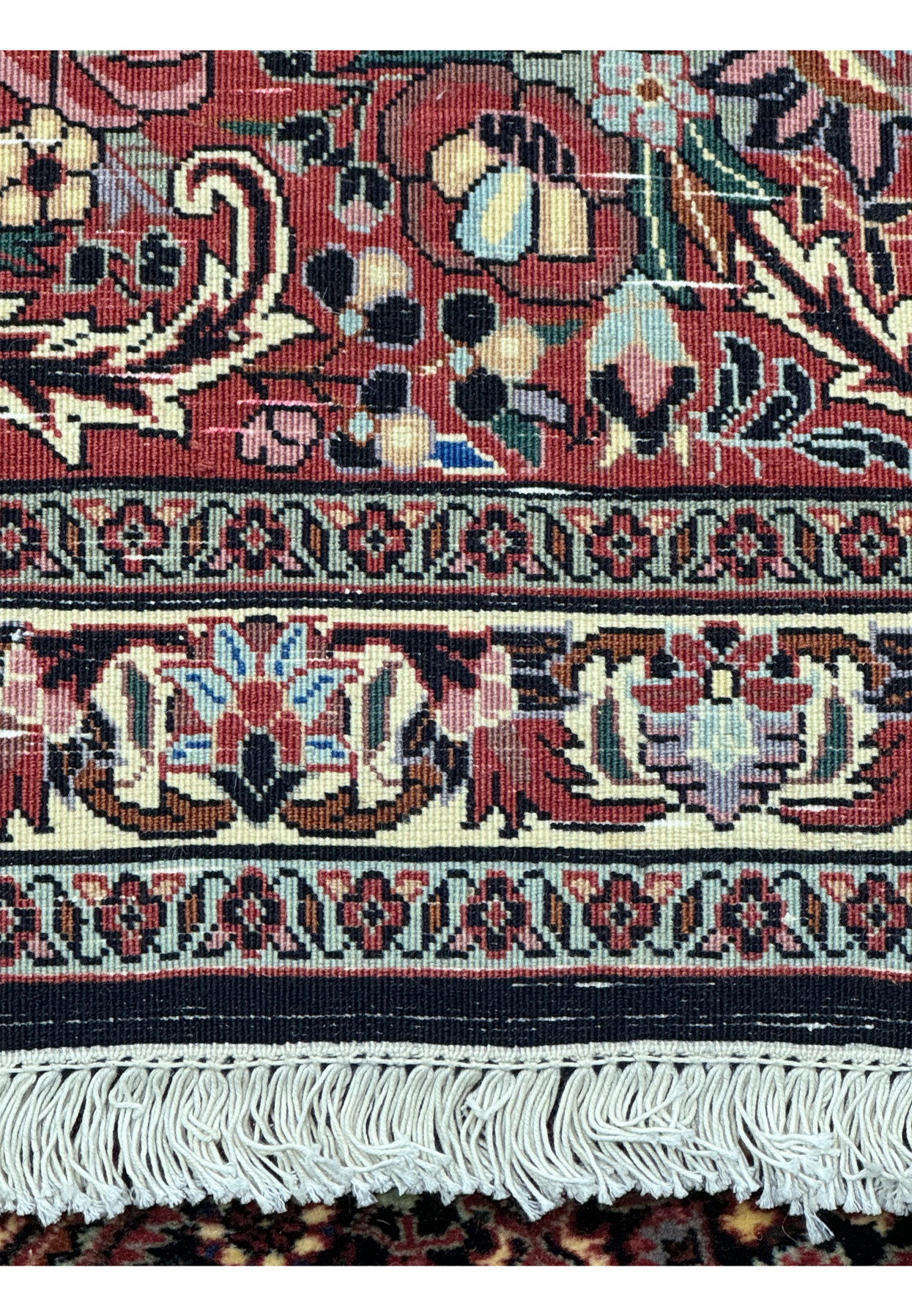 close-up of the backside and fringe and detailed border on the 13x20 Persian Bijar Rug.