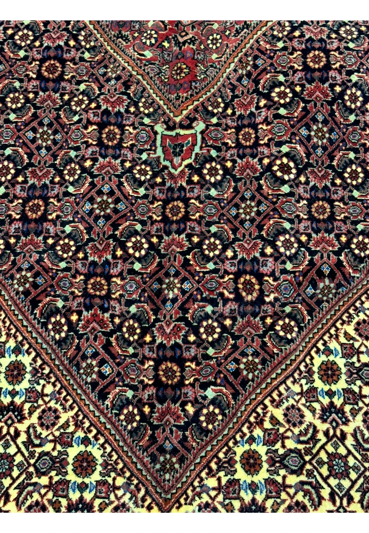 Zoomed-in view of the midfield on the 13x20 Persian Bijar Rug, featuring detailed floral and geometric patterns with a deep red background.
