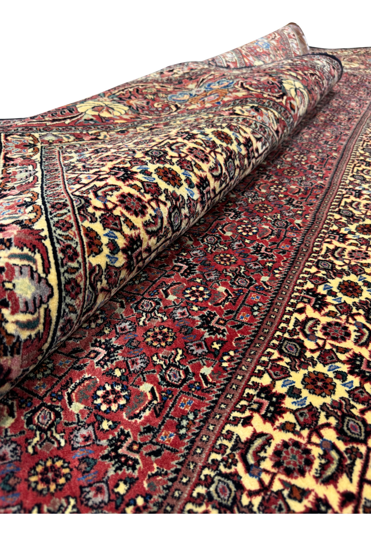 Rolled side view of the 13x20 Persian Bijar Rug, emphasizing the thickness and high knot density of this handmade masterpiece.