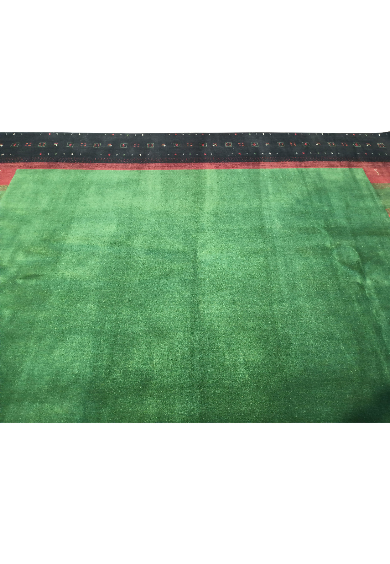 Close-up of midfield and border of 8'3" x 9'11" Gabbeh rug showcasing the bright green and bold stripes.