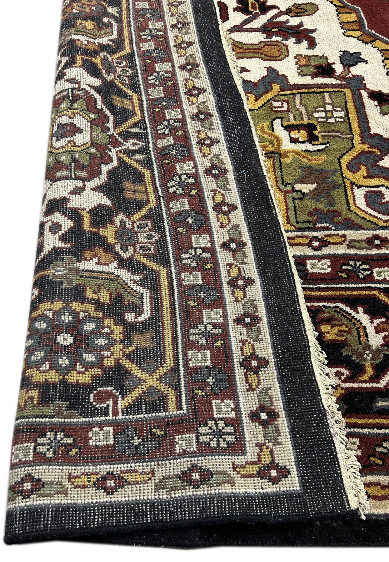 12 x 16 Oriental Heriz Rug folded to show backing and structure.