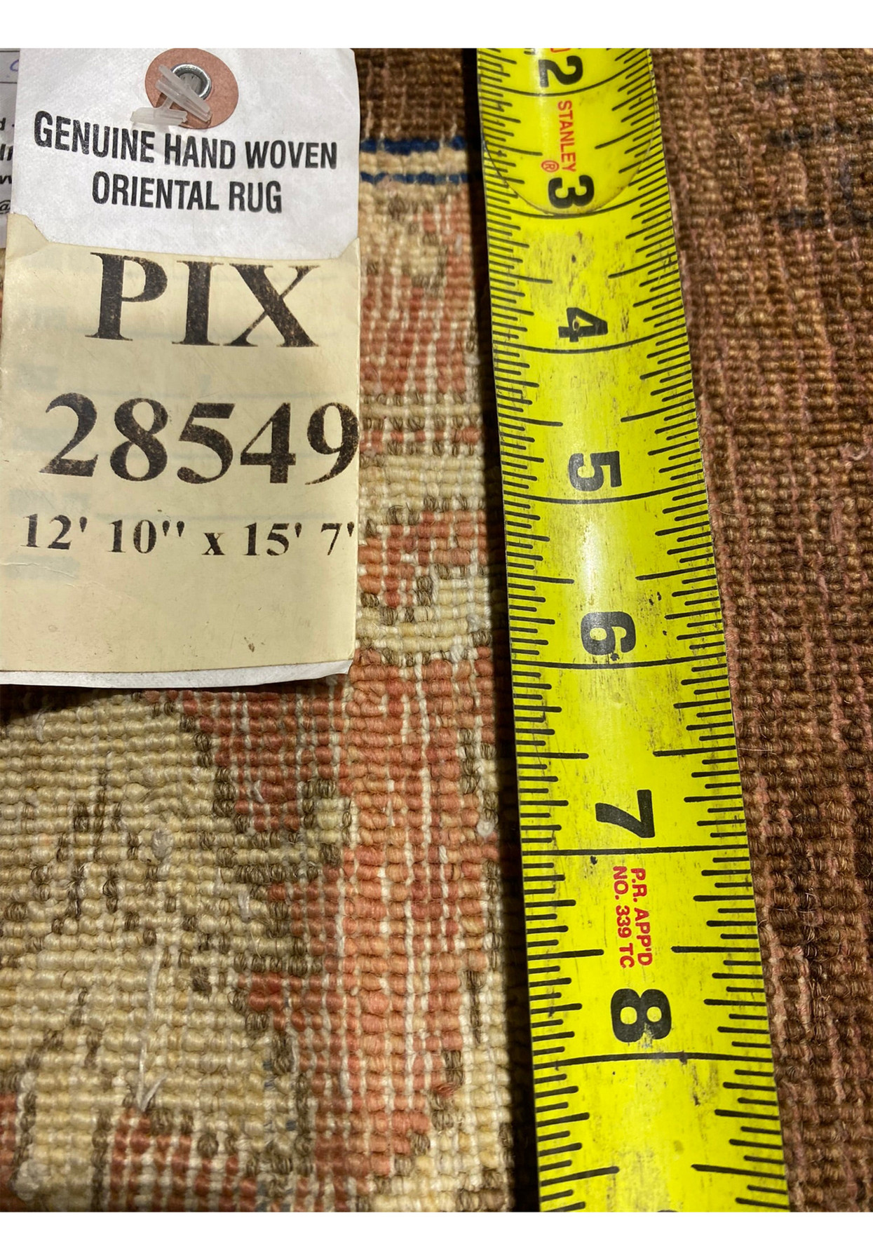 Close-up of 13x16 Ziglar rug tag with detailed size and weave information.