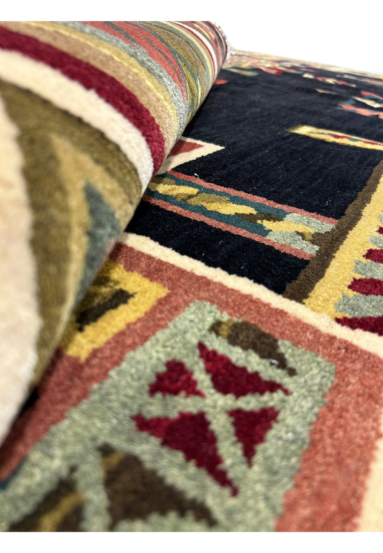 Rolled-up view of the 11'9" x 14'4" Modern Tribal Gabbeh Rug, focusing on the thickness and texture of the wool pile.
