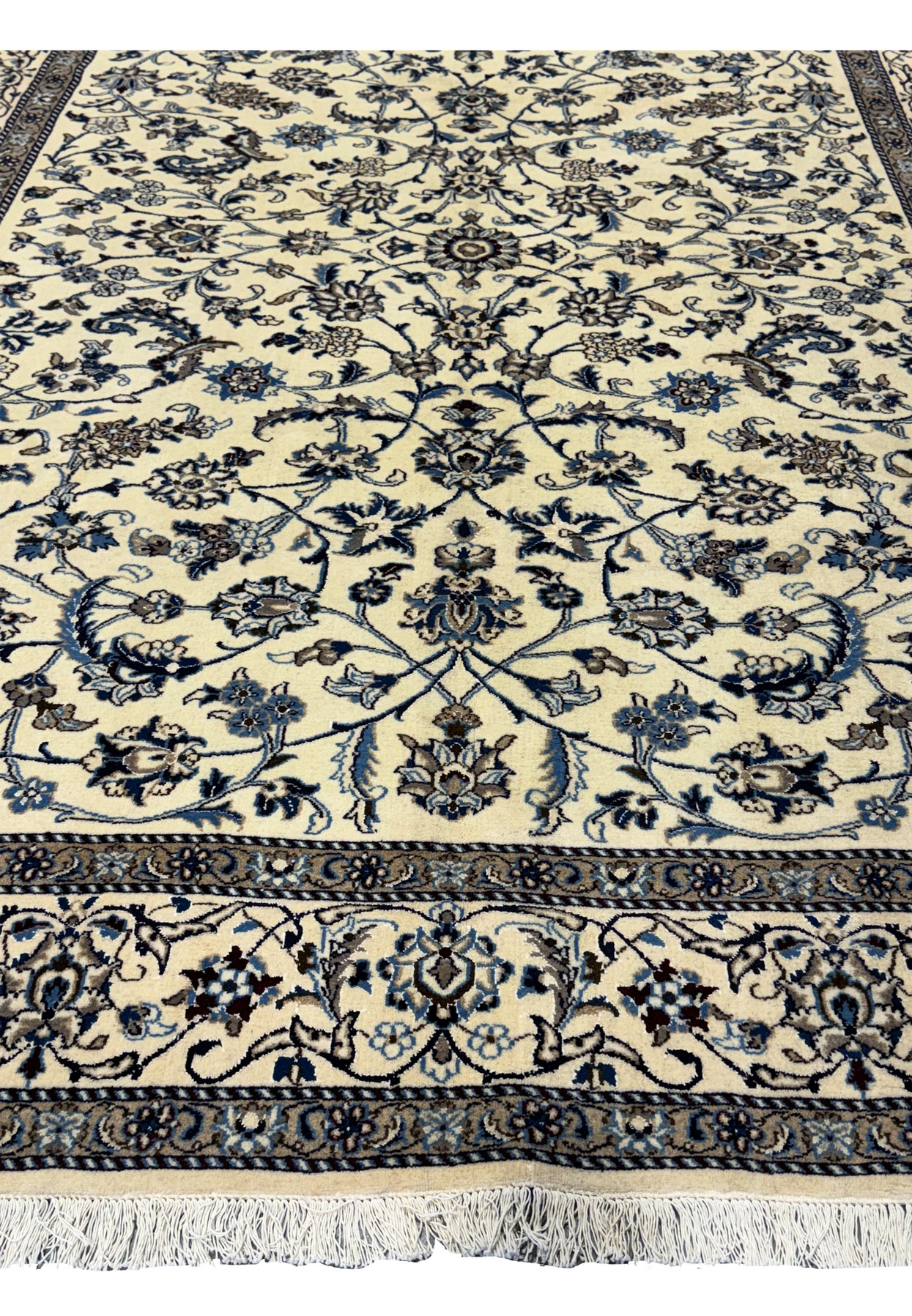 Lower section of the 8'2 x 11'6 Persian Nain rug with detailed floral designs.