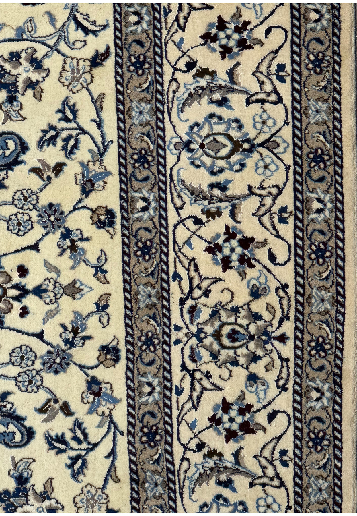 Side view highlighting the intricate border patterns of the 8'2 x 11'6 Persian Nain rug.