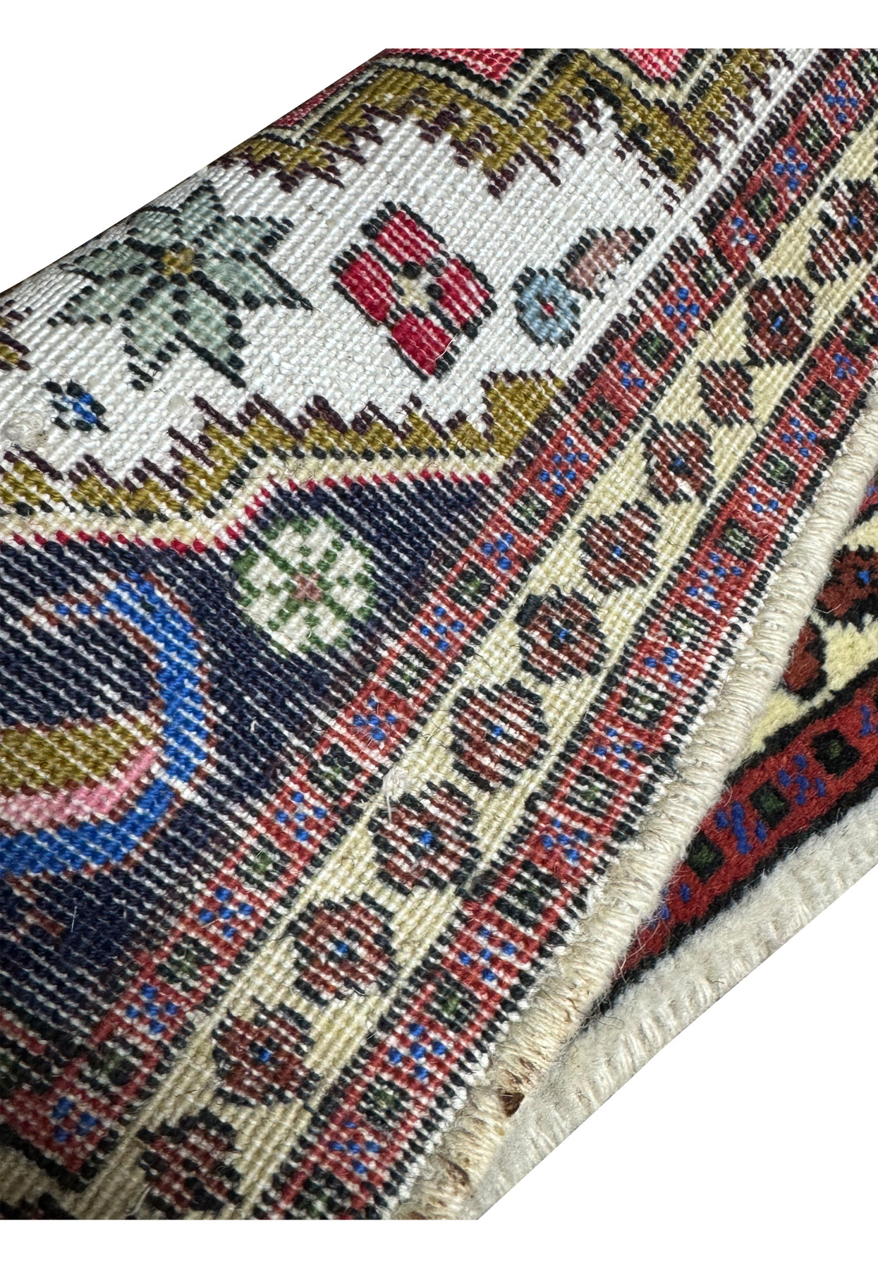 Backside of the 1'3 x 2' Persian Ardebil Baby Rug displaying the tight weave and quality craftsmanship of the geometric motifs.